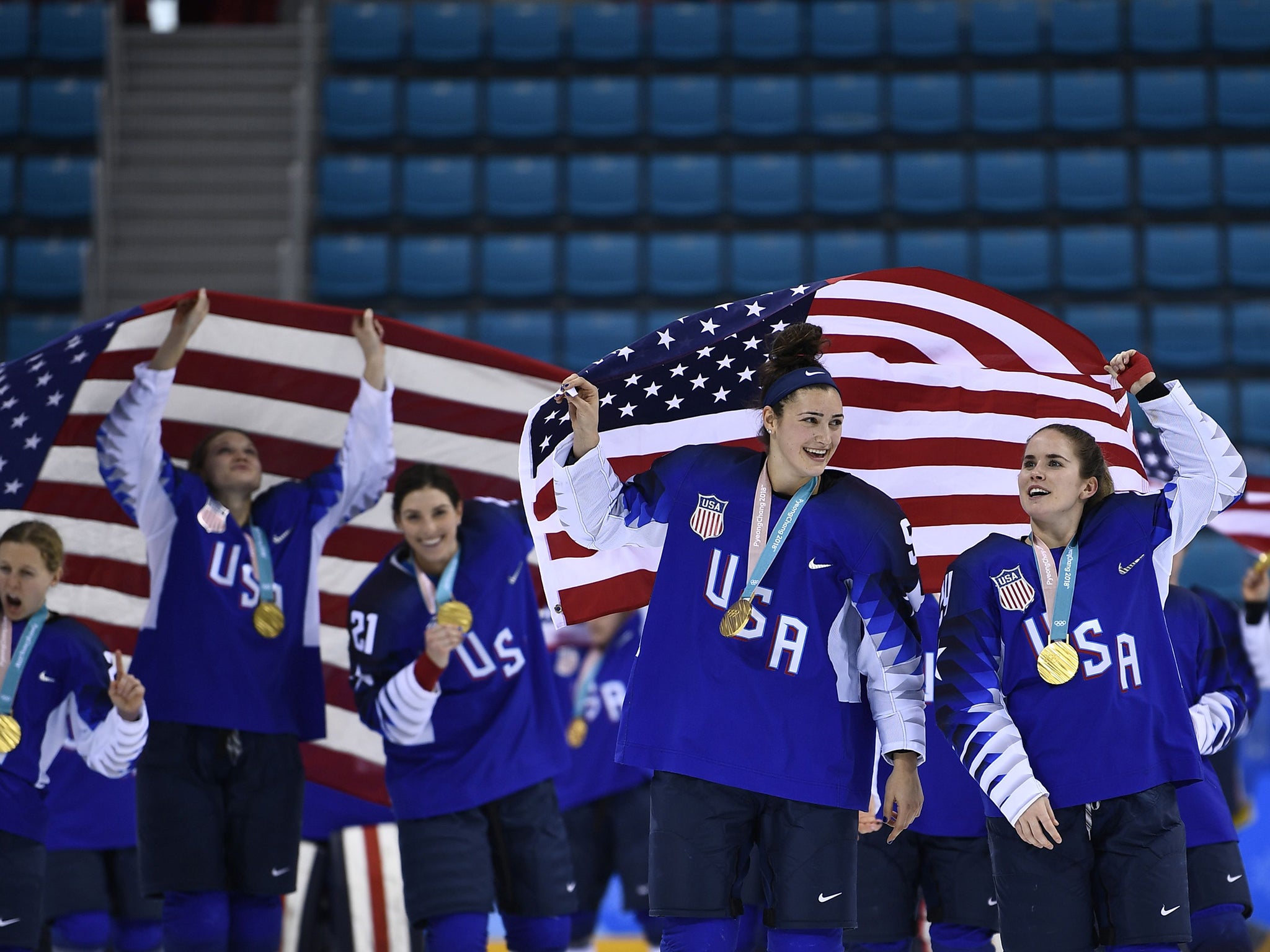 The US women's ice hockey team celebrate their victory over Canada