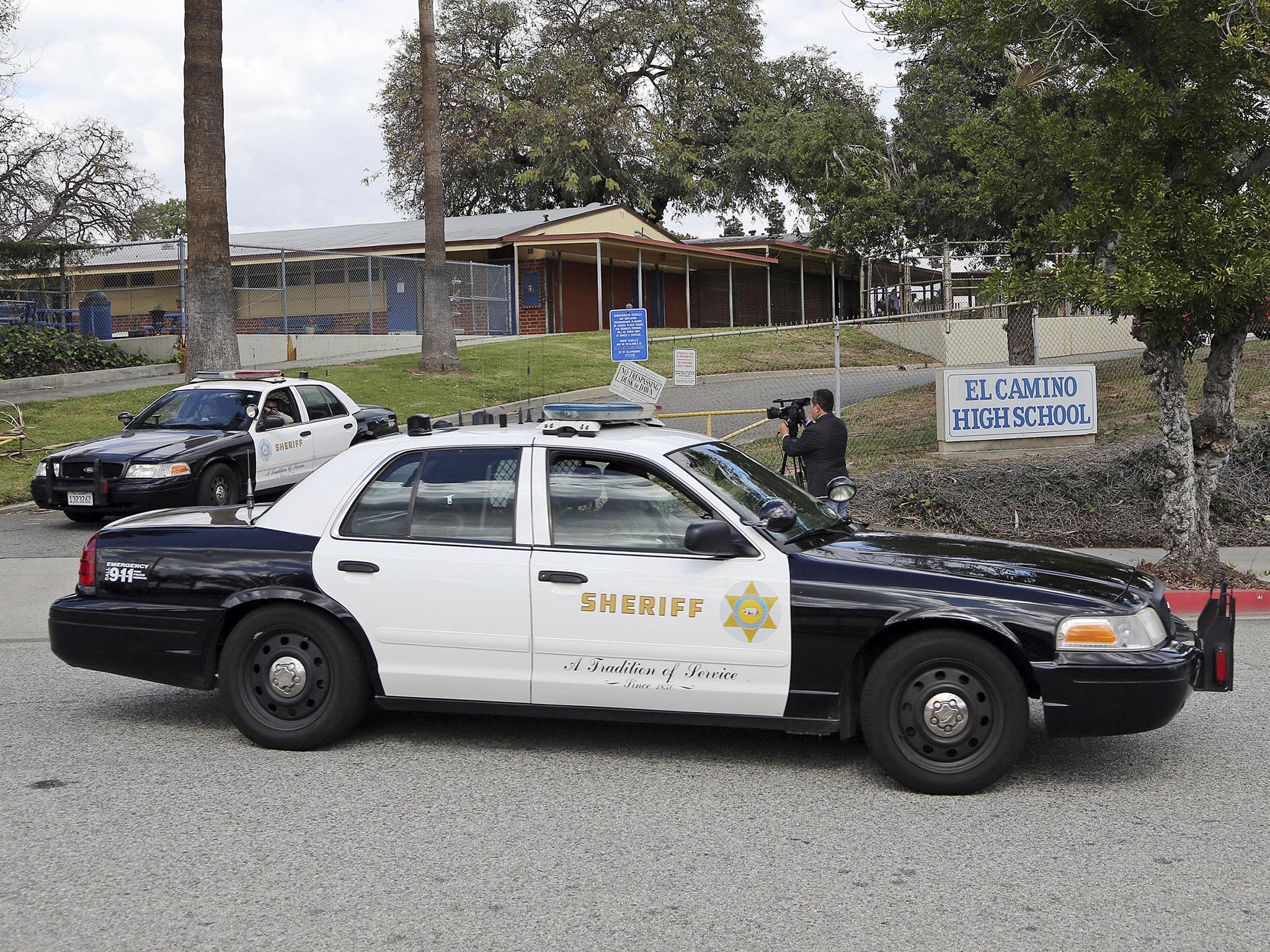 Los Angeles County Sheriff’s patrol cars leave El Camino High School in Whittier, California