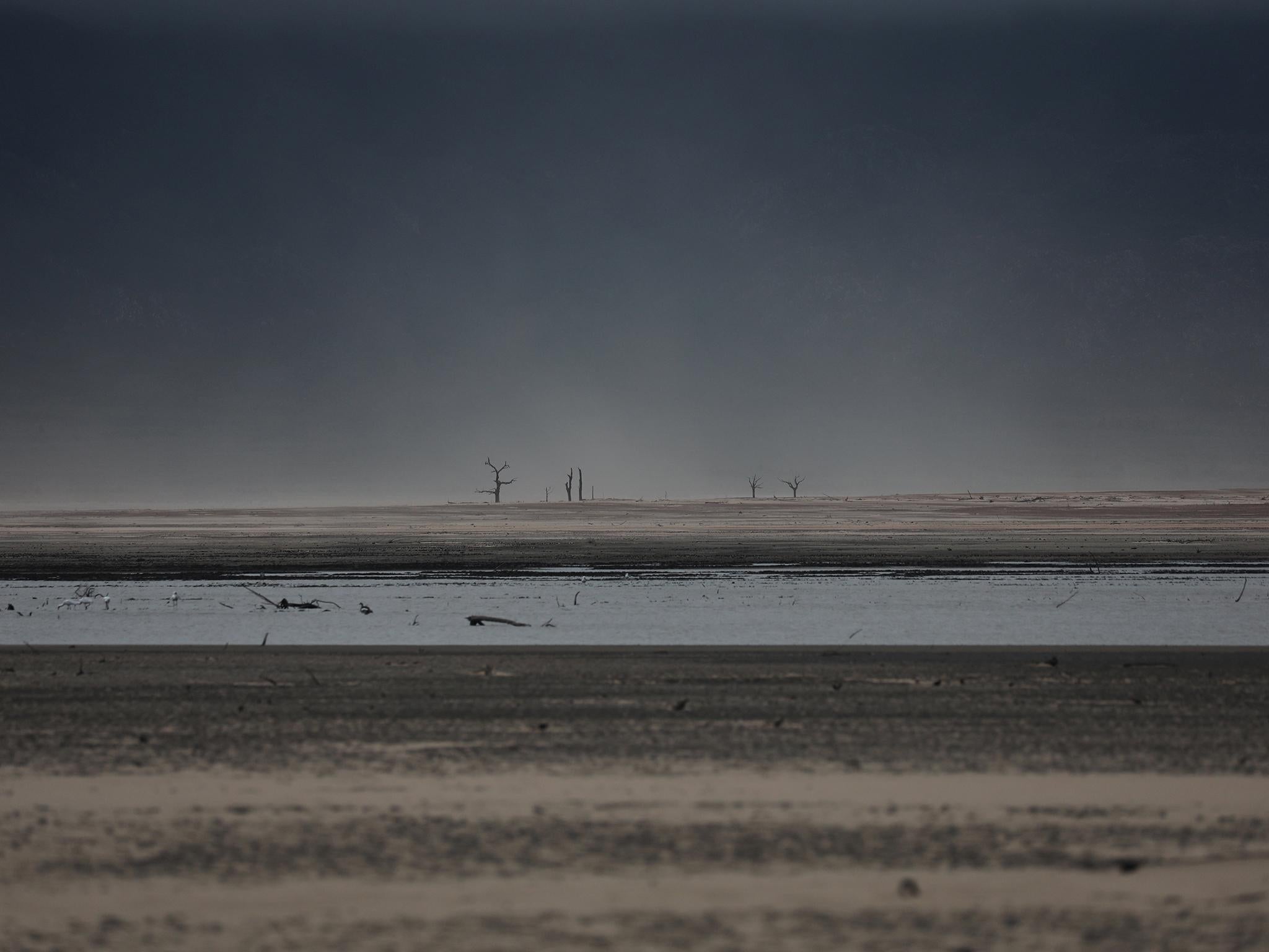 Sand blows across a normally submerged area at Theewaterskloof dam near Cape Town last month. The dam, which supplies most of the city’s potable water, is currently dangerously low