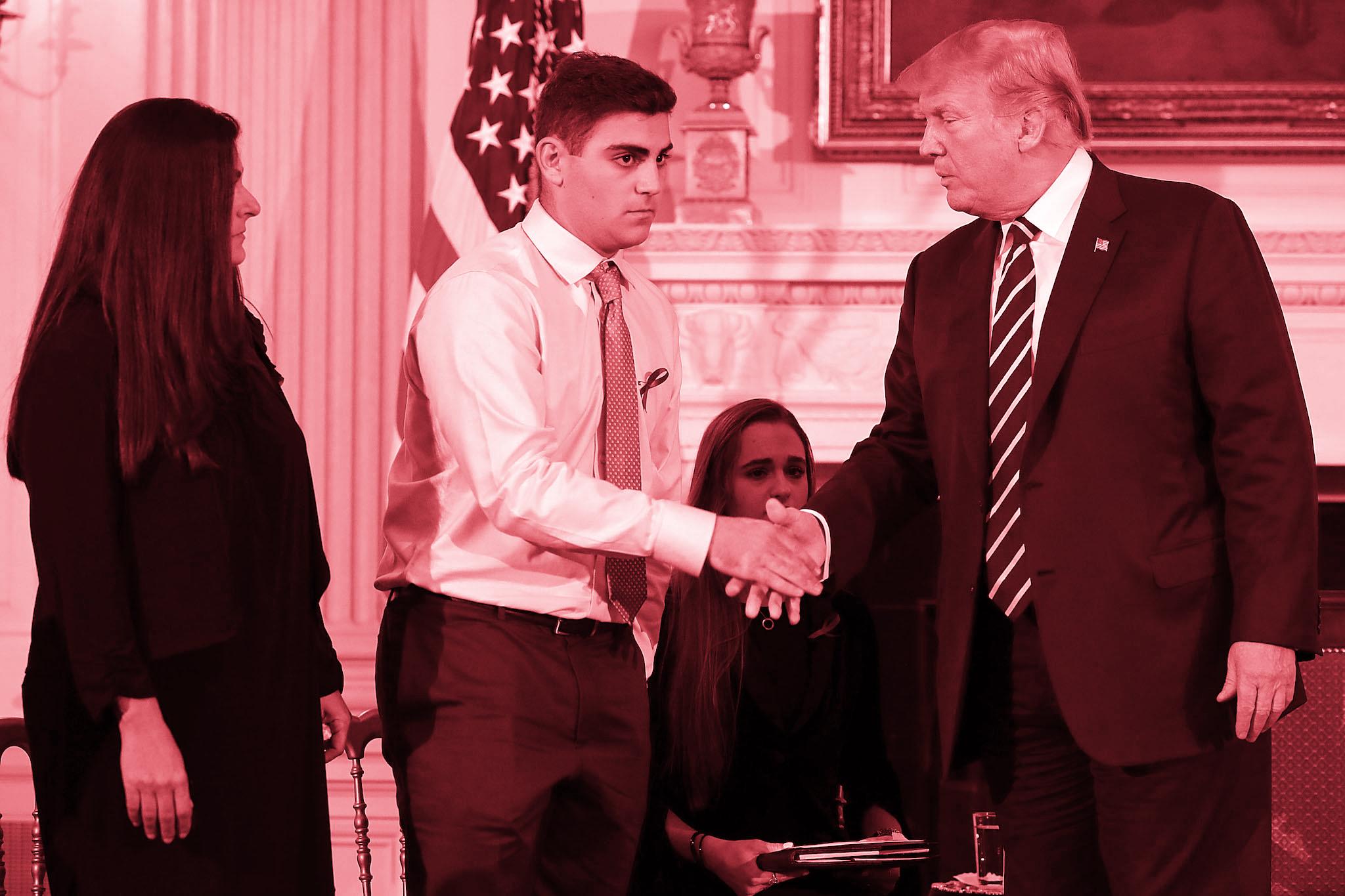 Donald Trump greets Marjory Stoneman Douglas High School shooting survivor Jonathan Blank and his mother Melissa Blank before hosting a listening session school shooting survivors, their parents, teachers and others