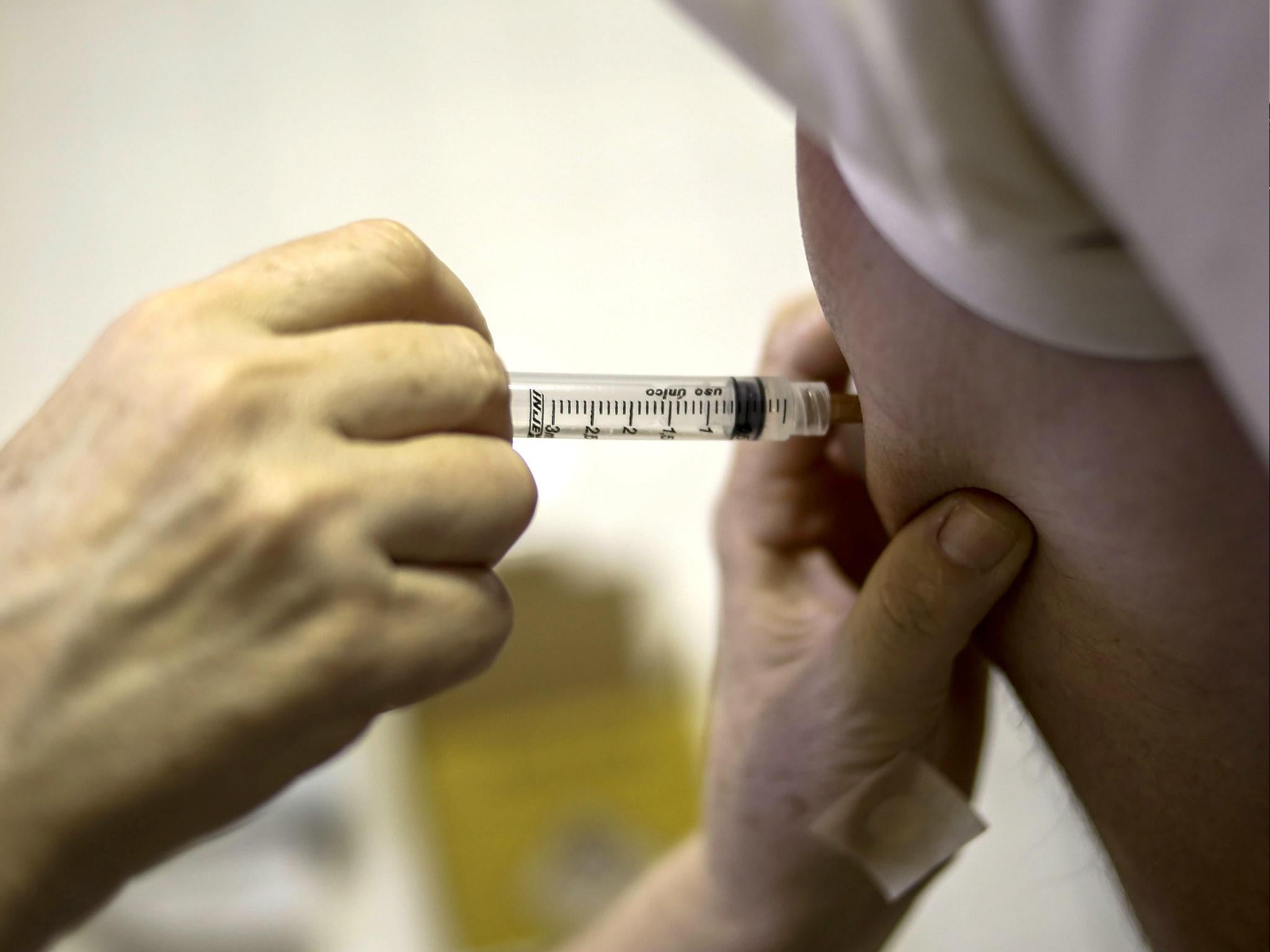 A patient receives a vaccine