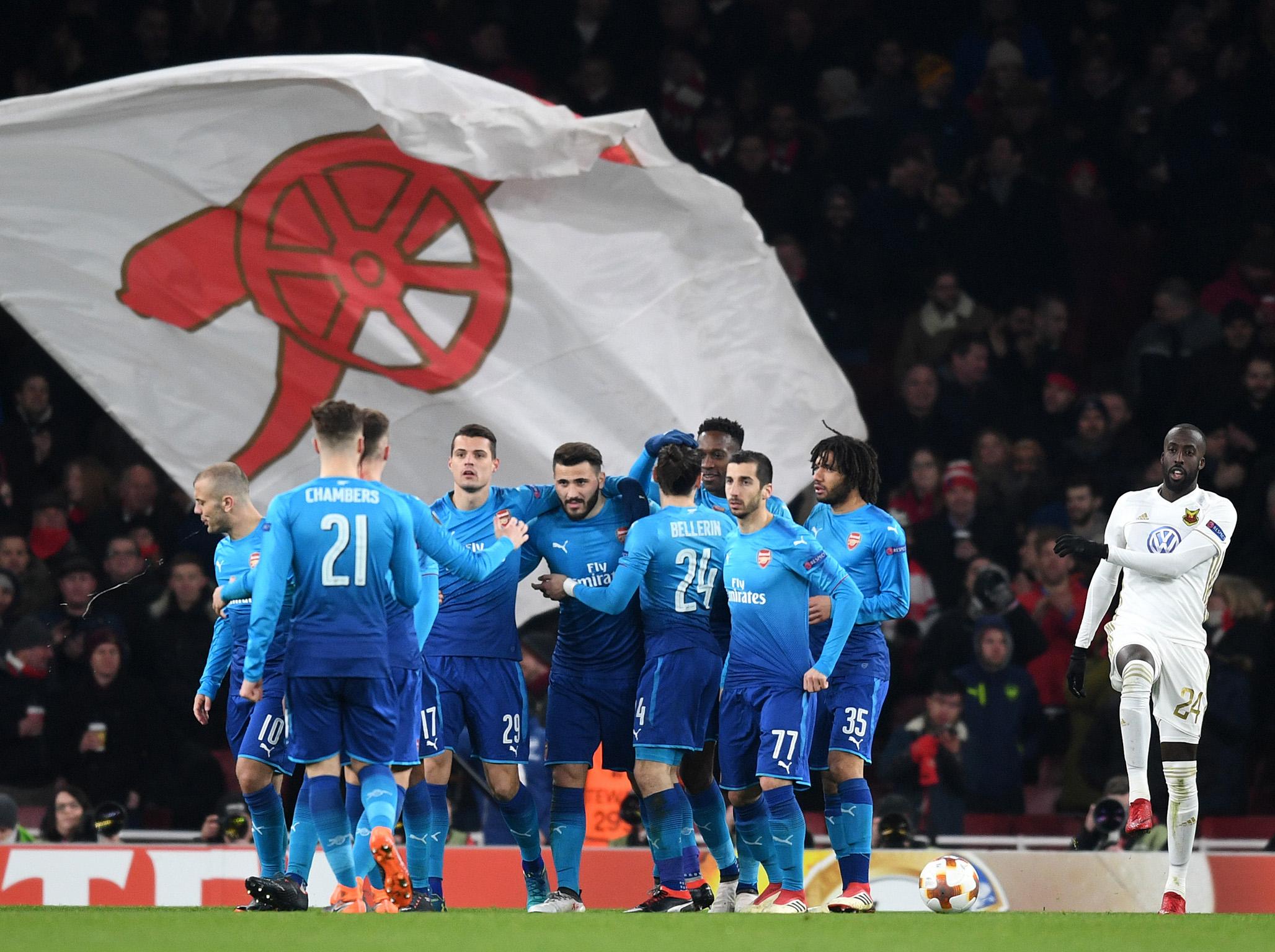 Sead Kolasinac, centre, celebrates his second-half goal