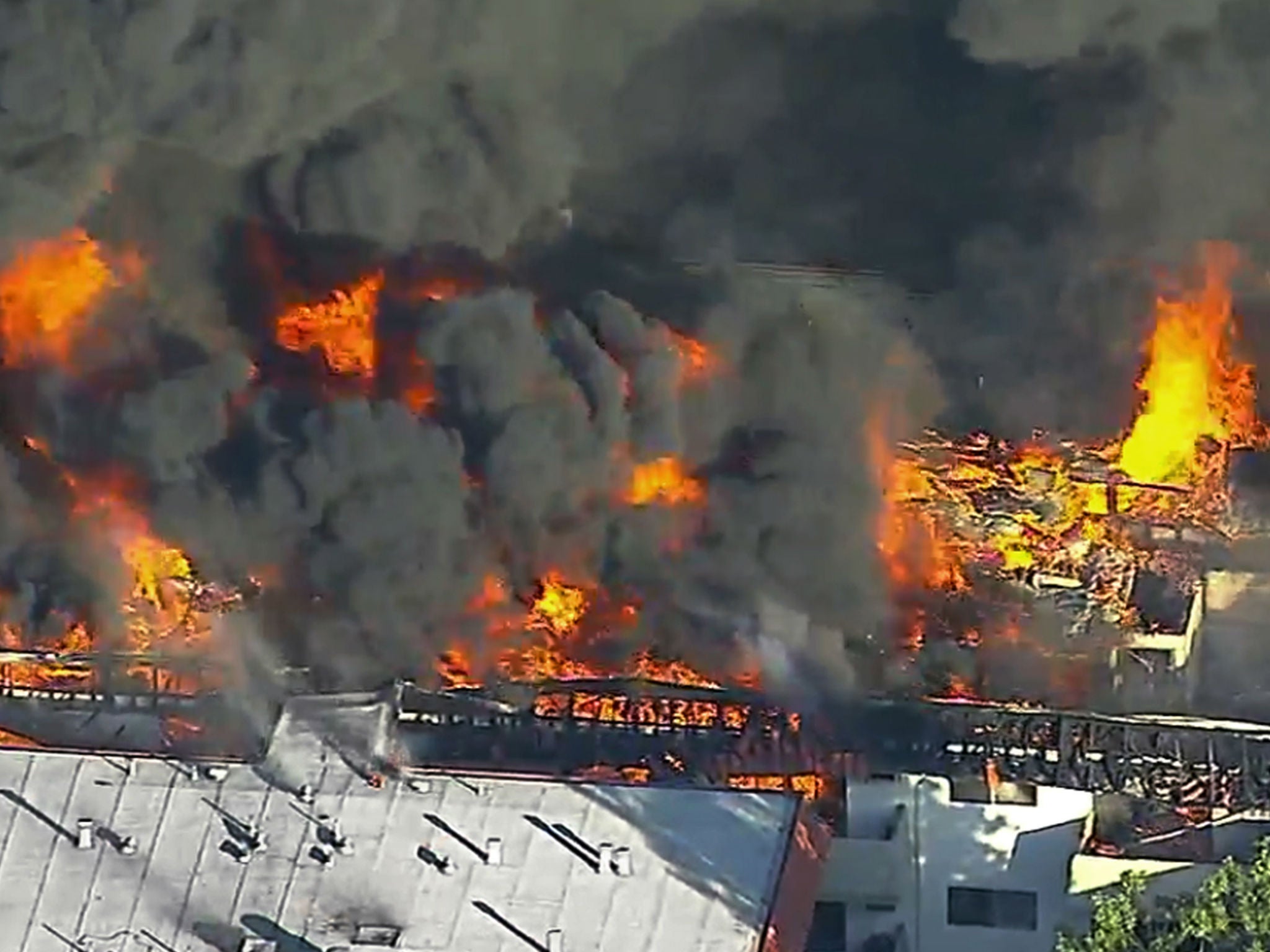 A three-alarm fire in a three-story apartment complex in Pico Rivera, California