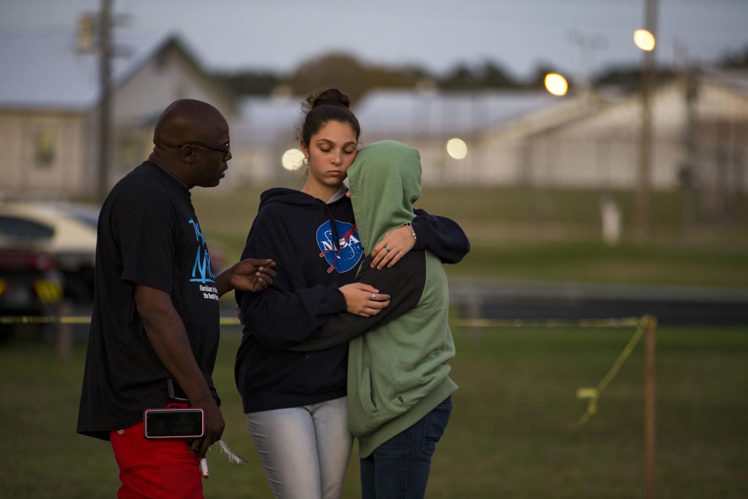 Herman Lindsey talks to people during a vigil for Eric Scott Branch in Gainesville, Florida