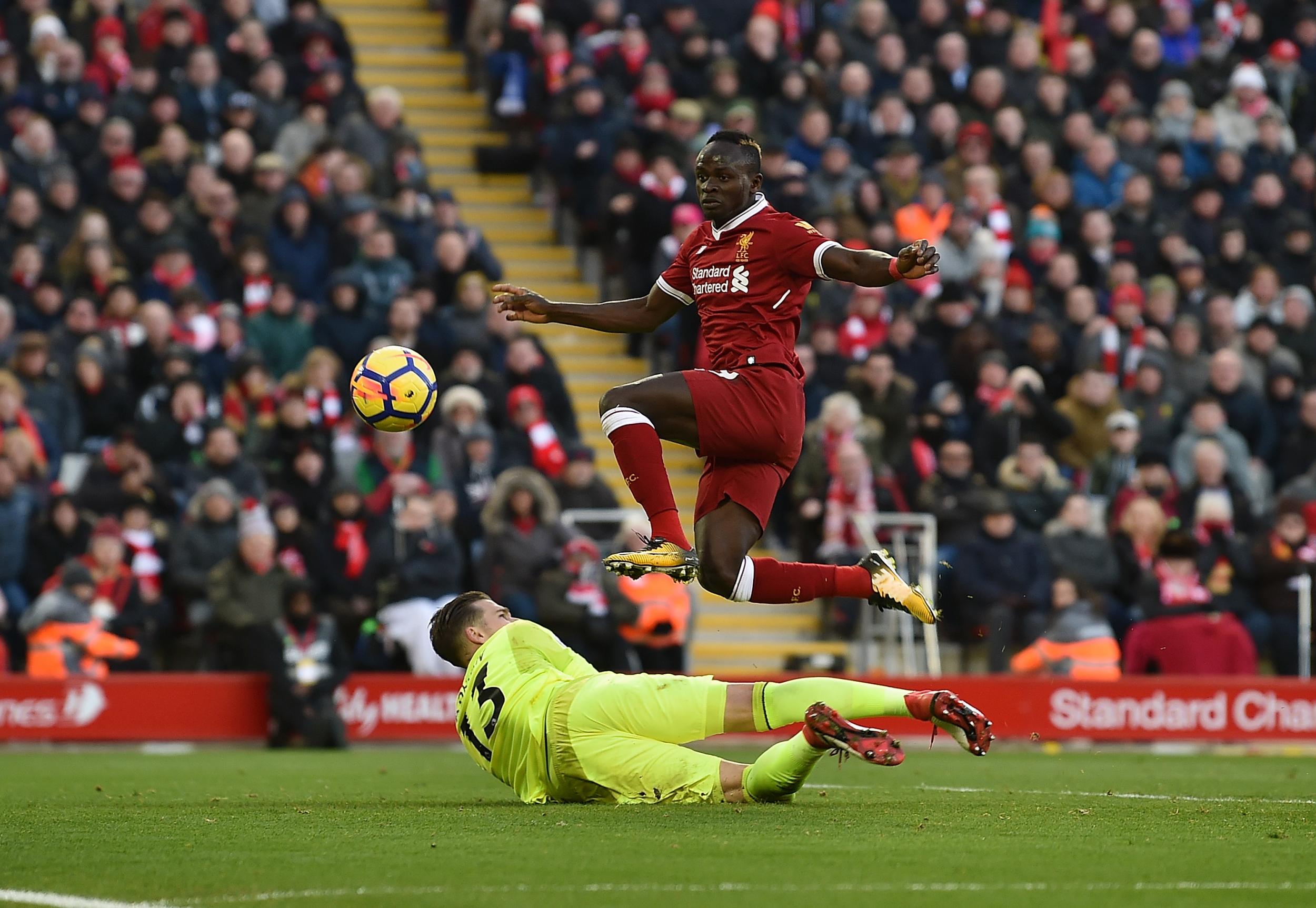 Sadio Mane dinks the ball over Adrian (Getty Images)