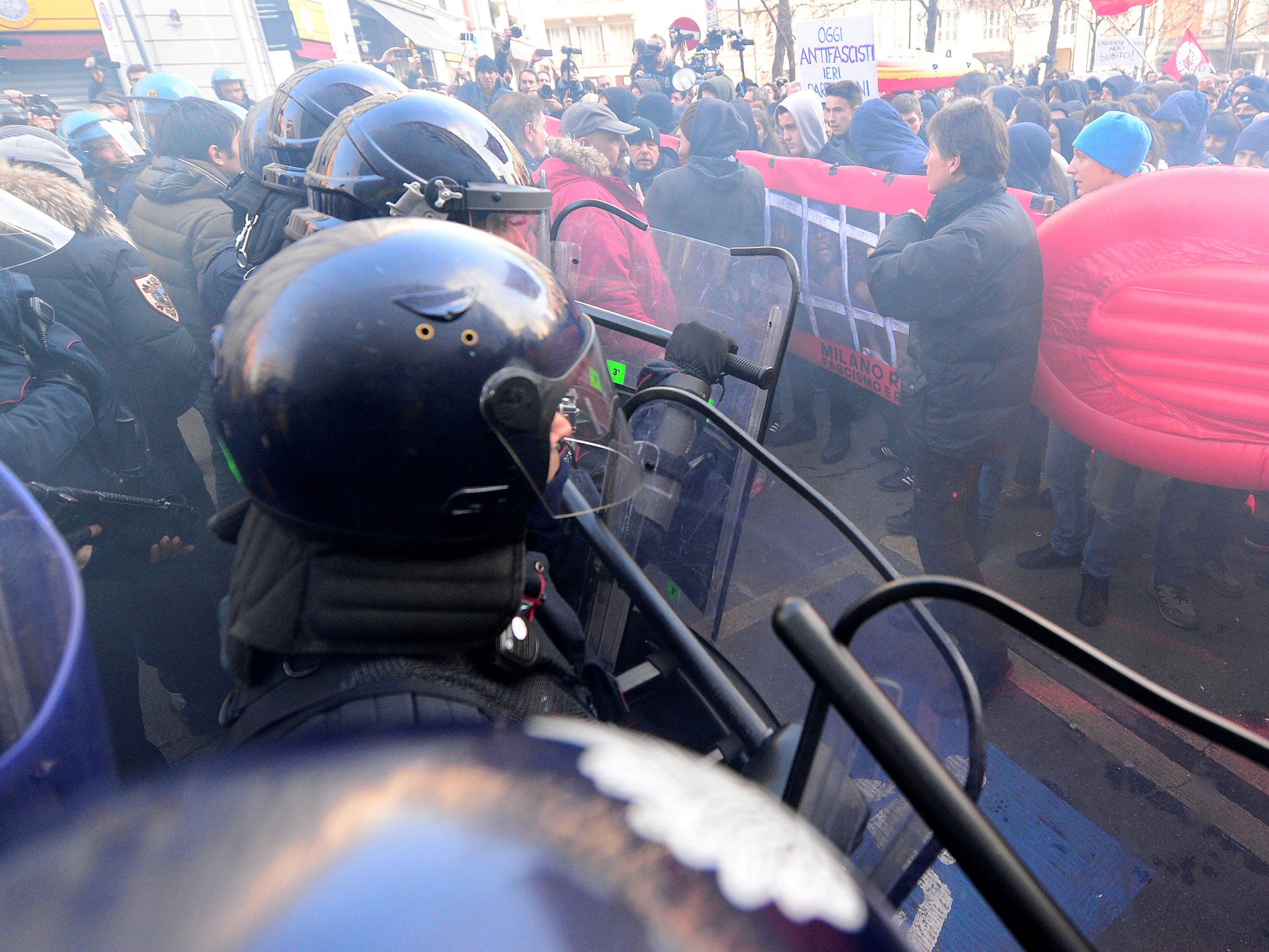 Demonstrators confront police during an anti-fascism demonstration in Milan