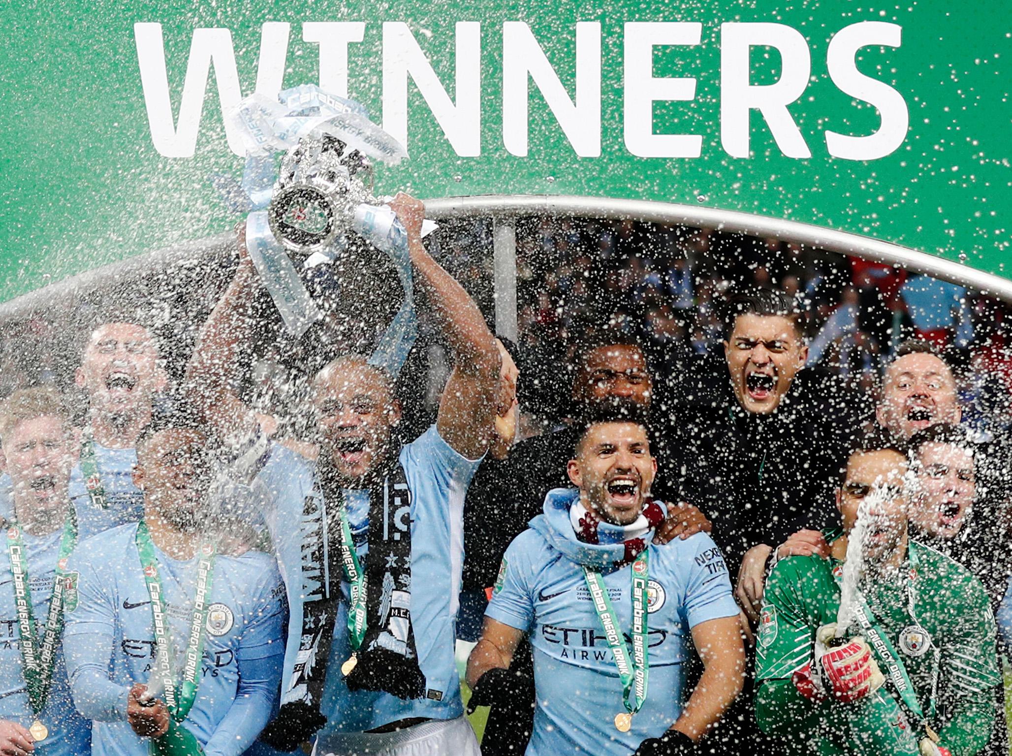 &#13;
City captain Vincent Kompany lifts the EFL Cup &#13;