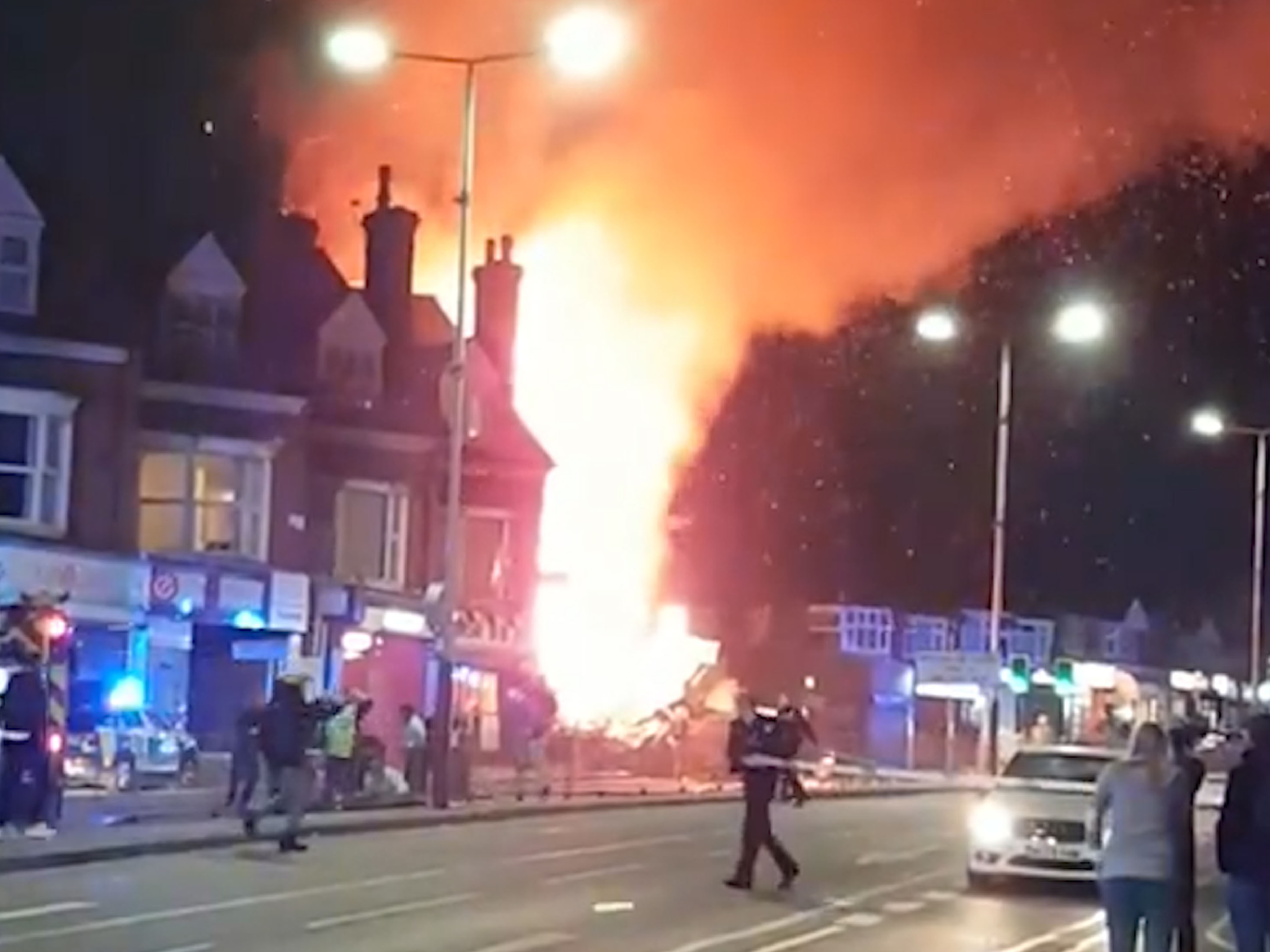 Emergency services attend the scene following an explosion at a shop on Hinckley Road in Leicester