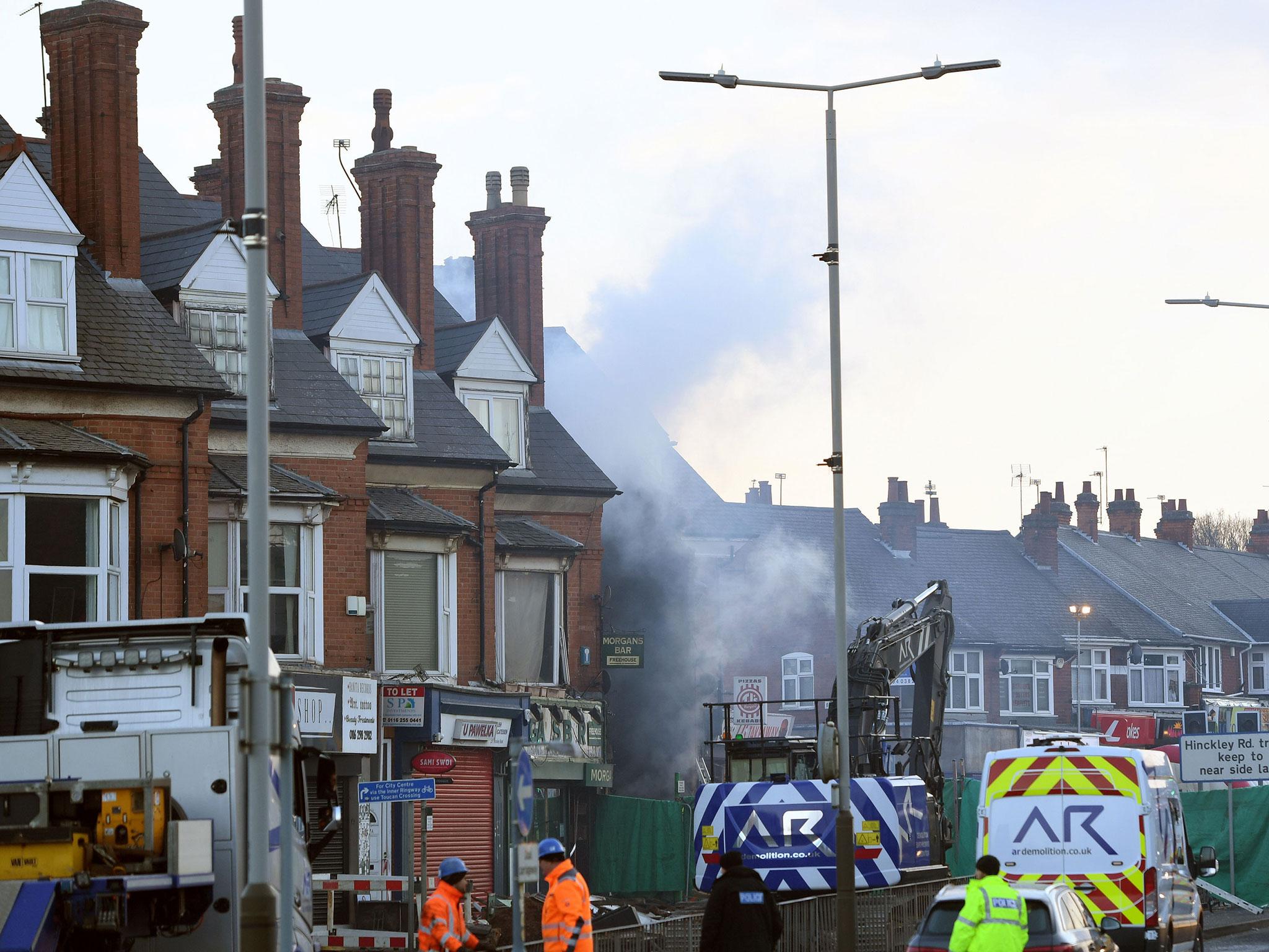 Emergency personnel continue to work at the scene on Hinckley Road in Leicester