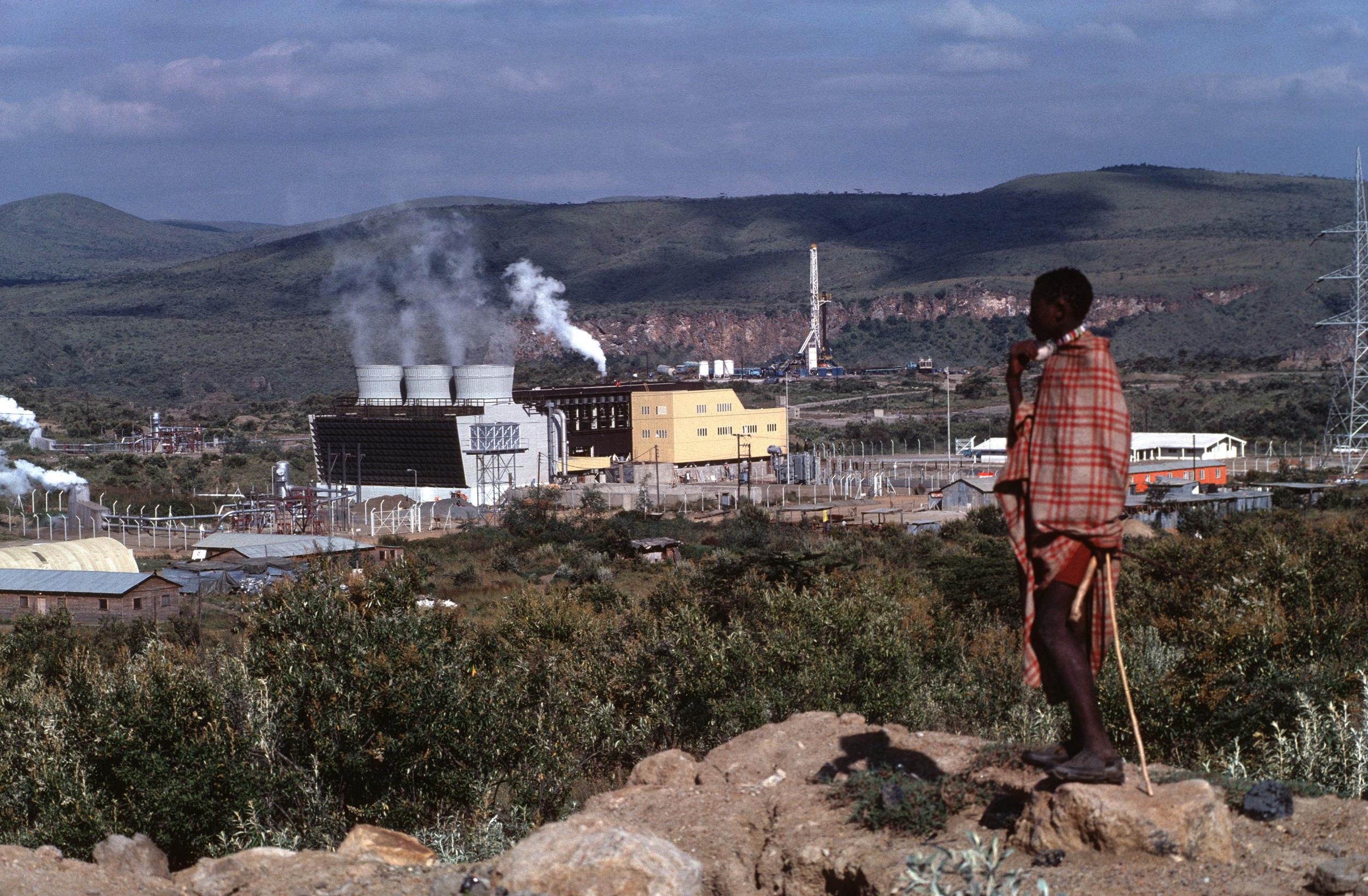 A Masai tribesman looks out over a geothermal power station in Hell’s Gate