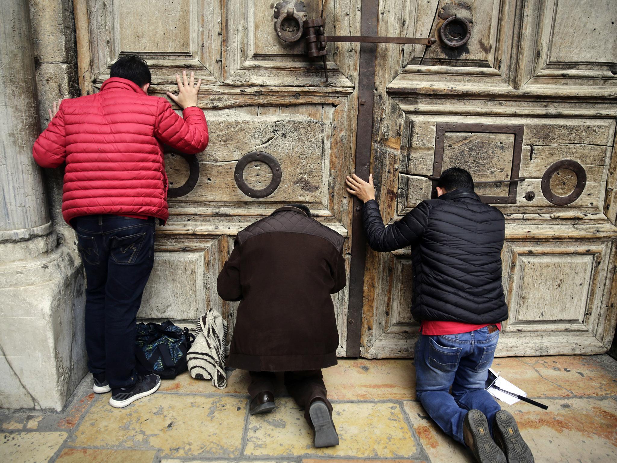 Worshippers locked out of the traditional site of Jesus' crucifixion and resurrection