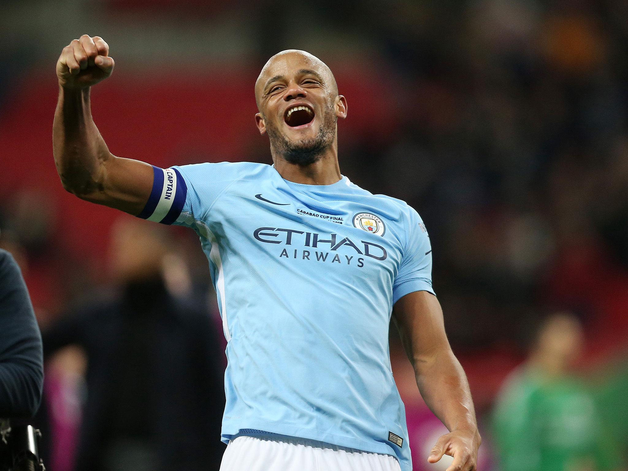 Vincent Kompany celebrates Manchester City's League Cup success on Sunday