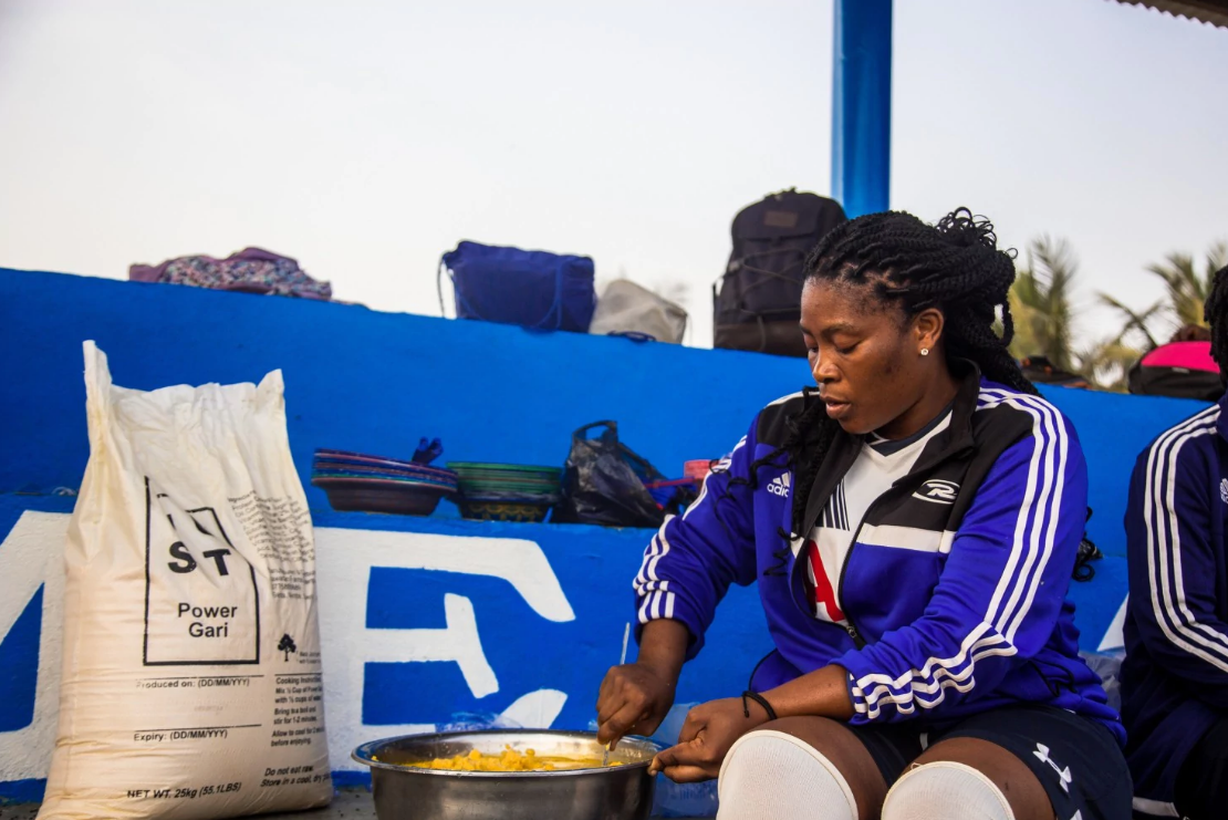 A pot of Power Gari is prepared at a football training ground in Liberia (Just)