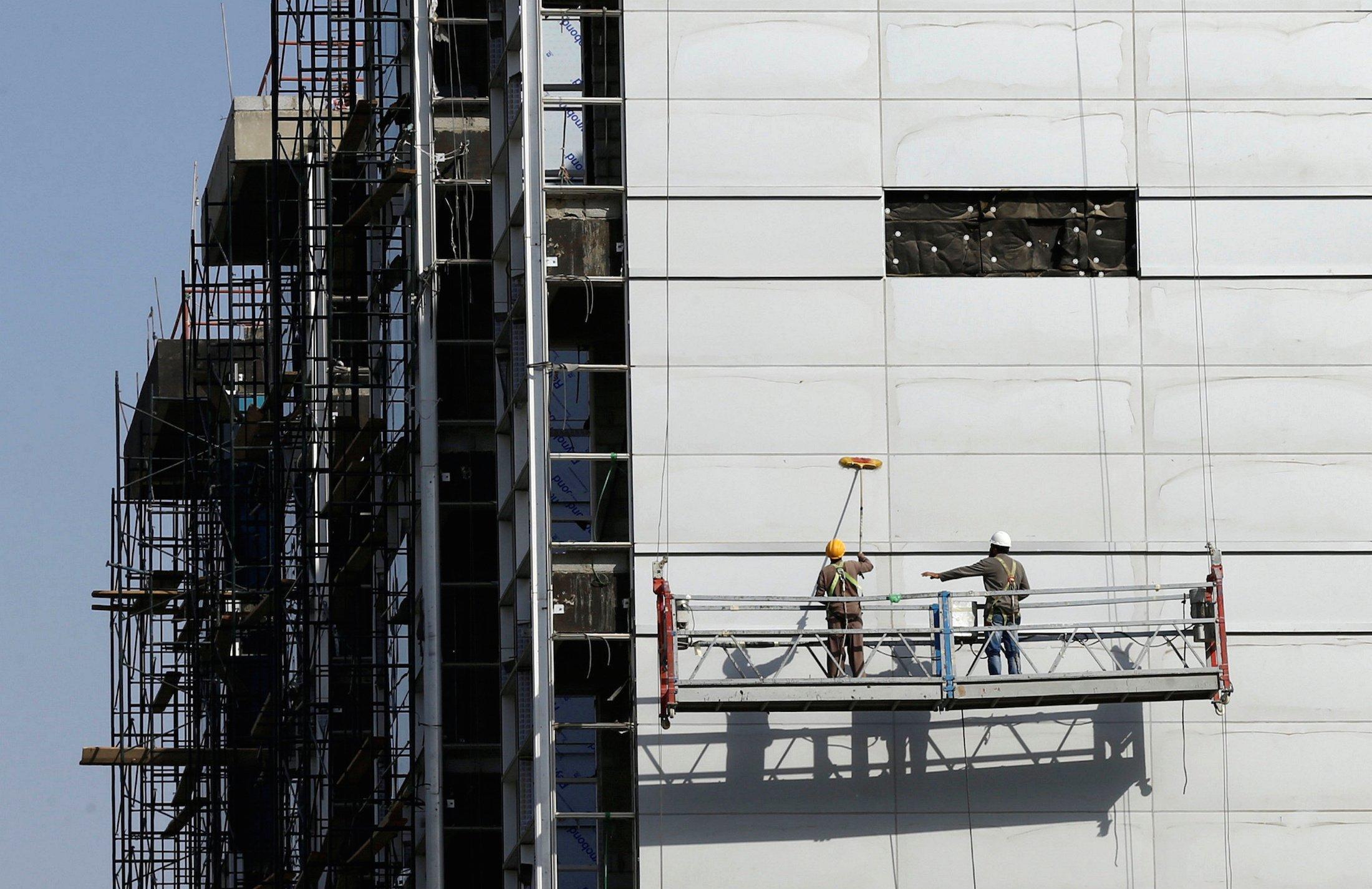 Labourers work at the construction site of a building in Riyadh, Saudi Arabia, October 18, 2017. Reuters