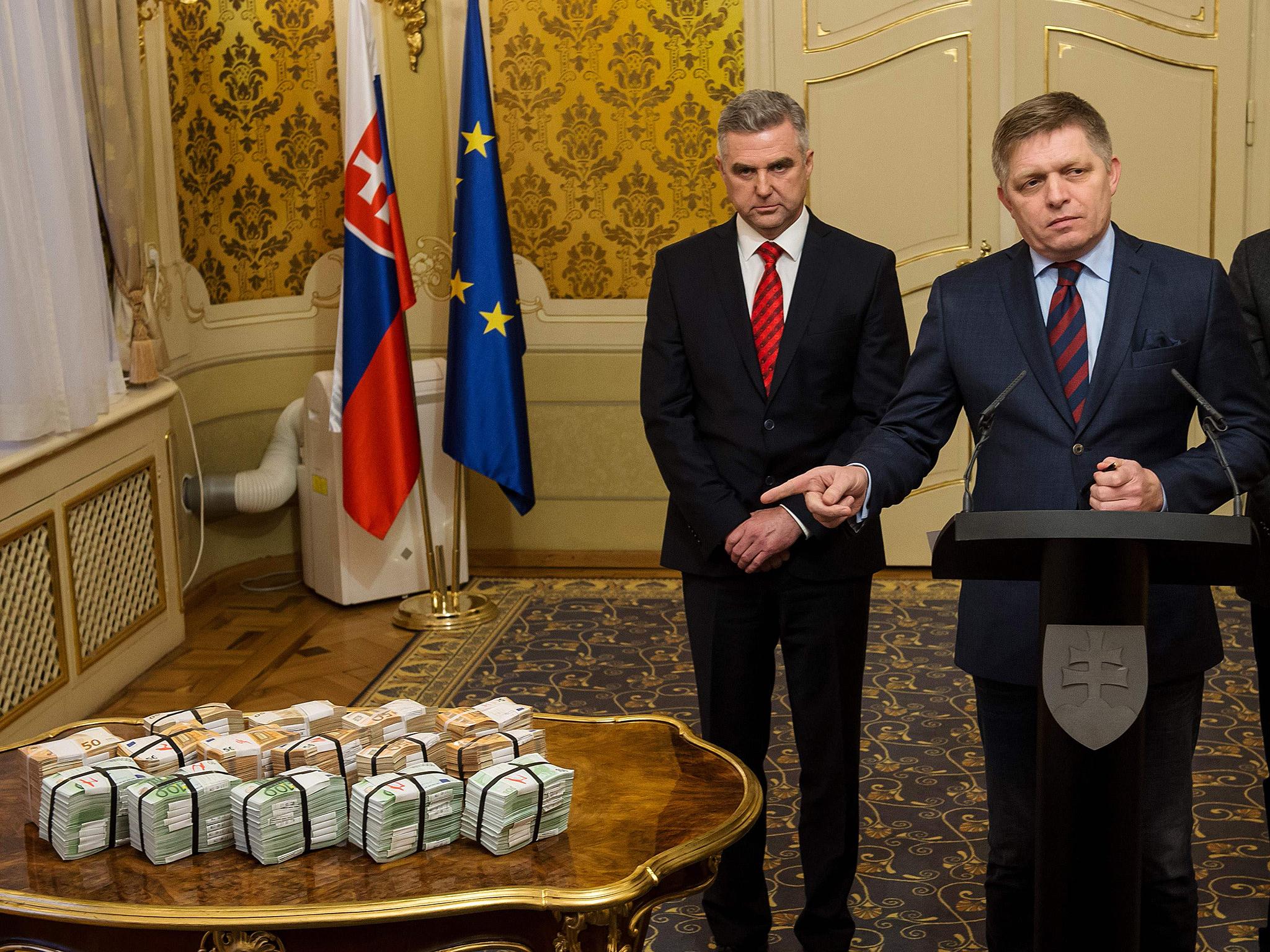 Robert Fico got the cash reward out and put it on the table. He denies any link to the mafia