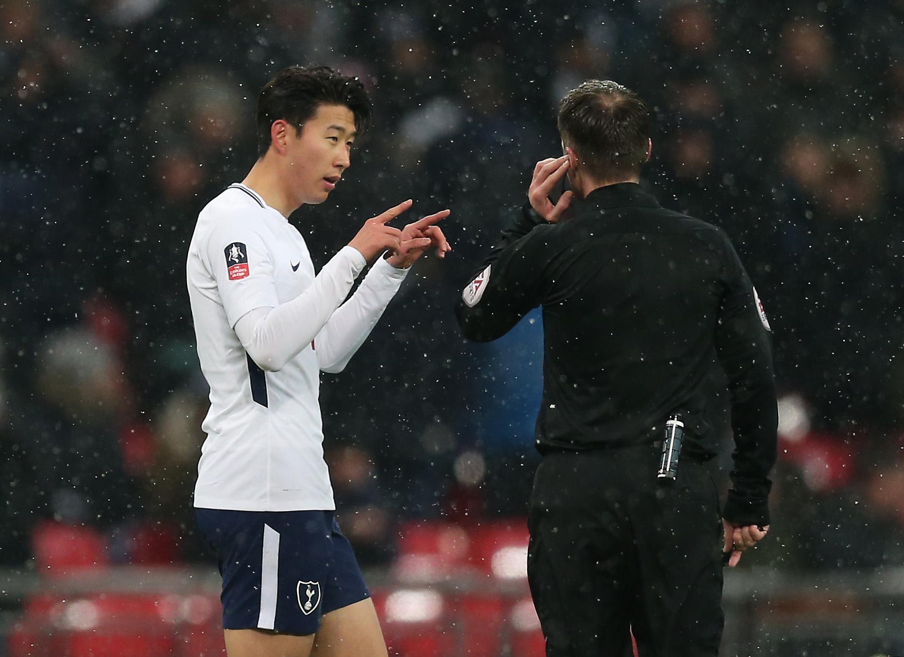 Son Heung-min tries to discuss a decision with Paul Tierney