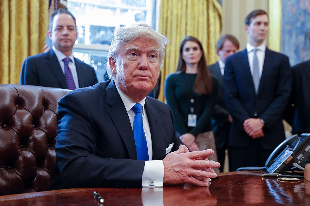 Former White House communications director Hope Hicks (second right) behind Donald Trump is the latest to leave the White House bunker