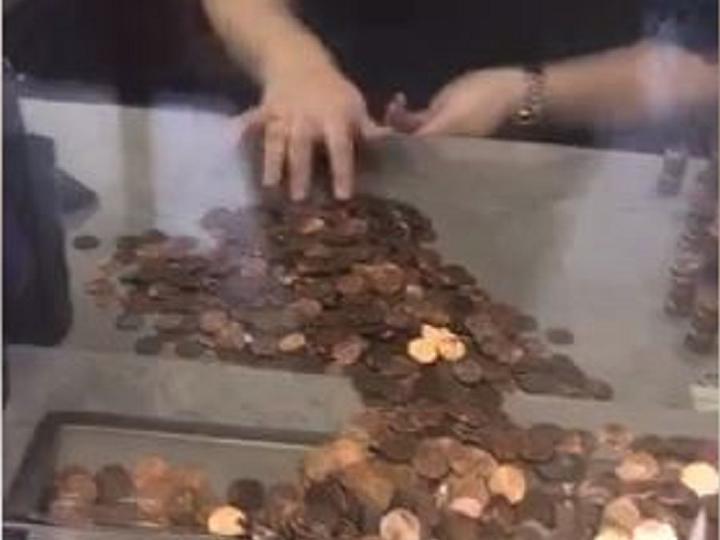 She shared a Facebook live video of herself walking into a city management building to cough up her fine with more than 49,000 pennies