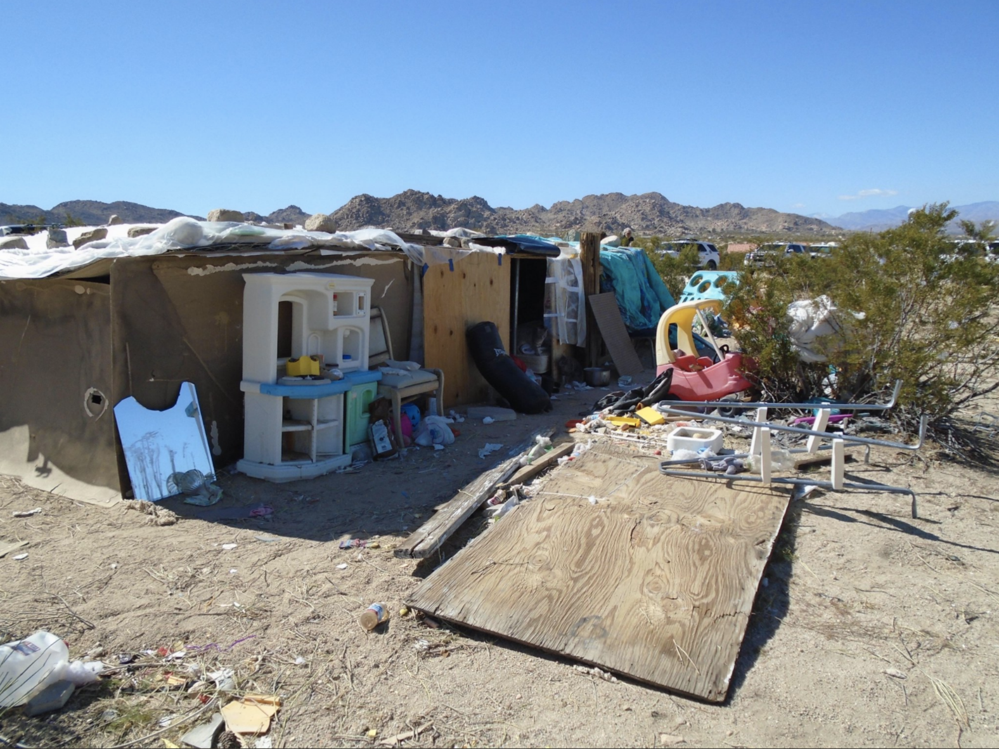 The sheriff's department said three children had been living in this box for years