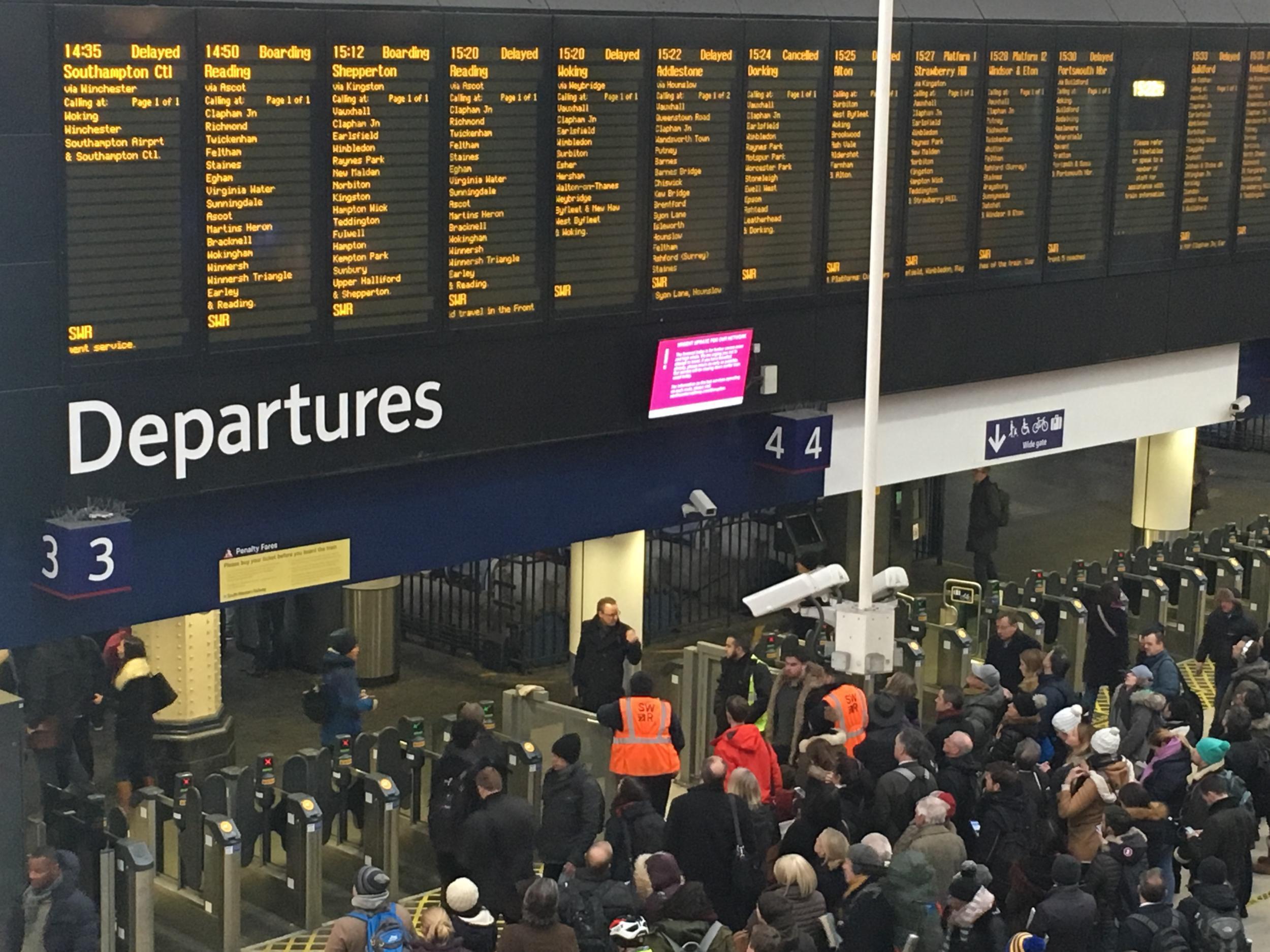 Waterloo surrender: commuters waiting for delayed trains at Britain’s busiest station