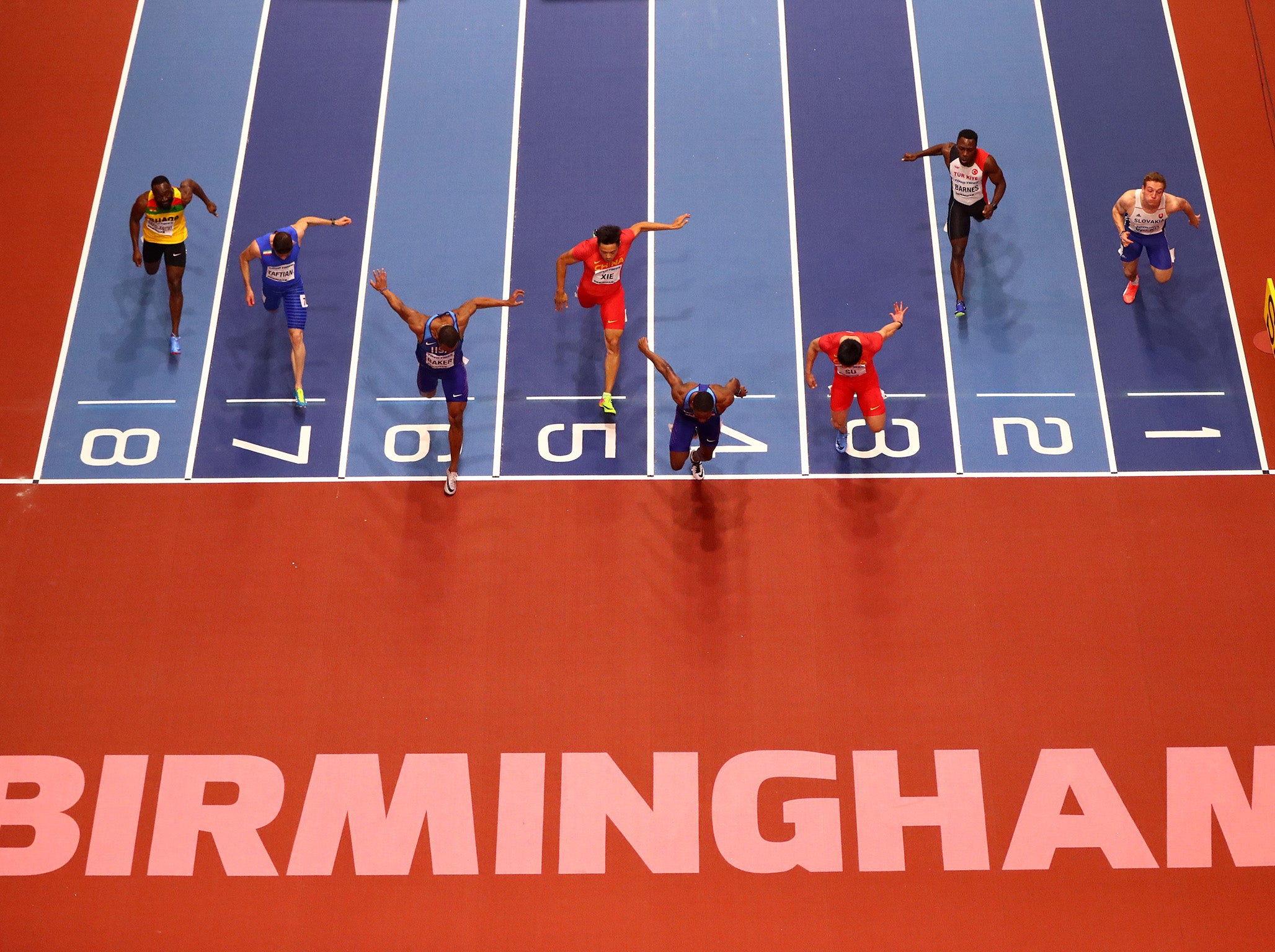 Christian Coleman cross the line to claim the 60m world title (Getty)