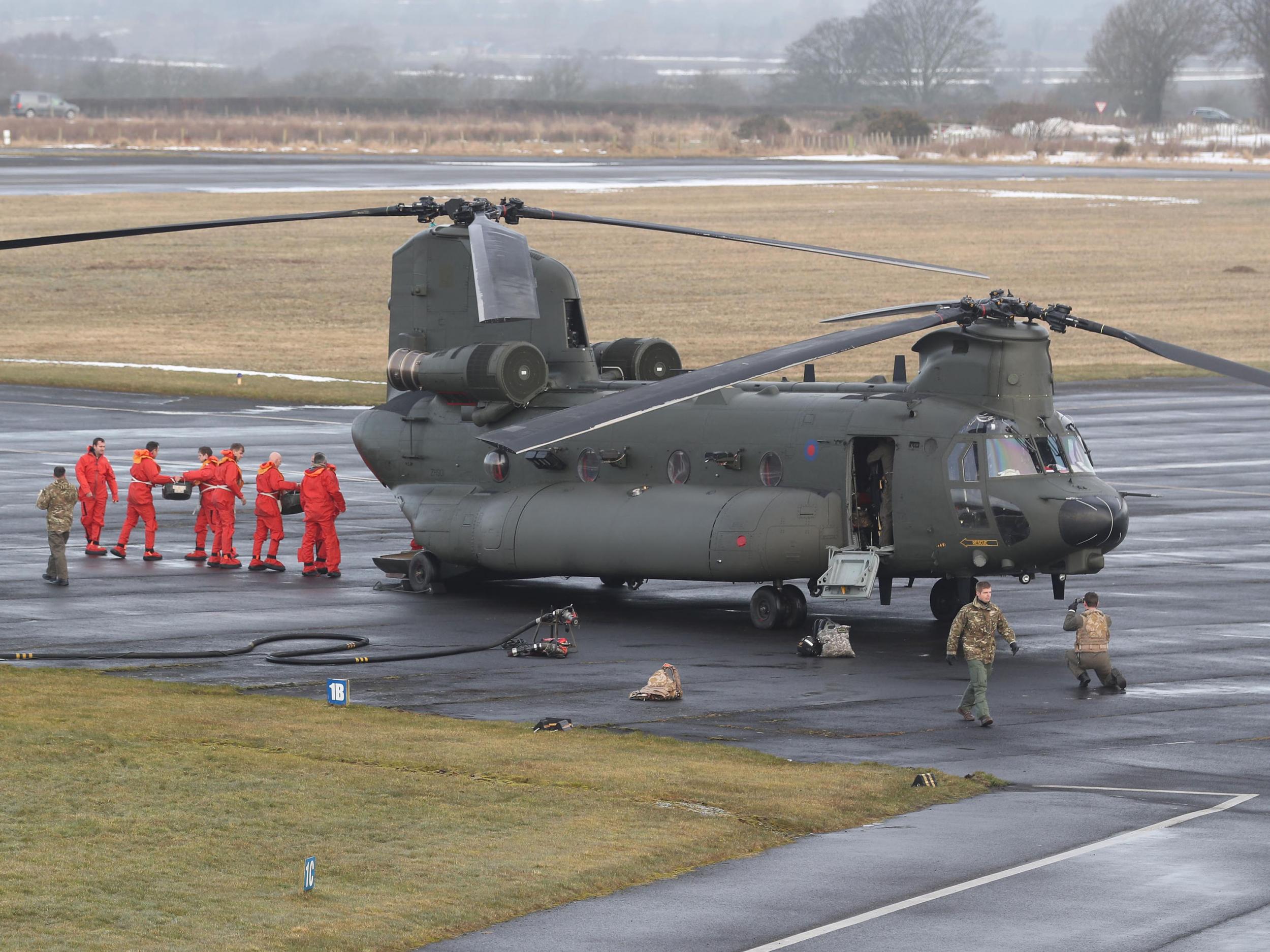 An RAF Chinook helicopter at Carlisle airport before supplies are loaded and delivered to communities still cut off after recent heavy snow in Cumbria