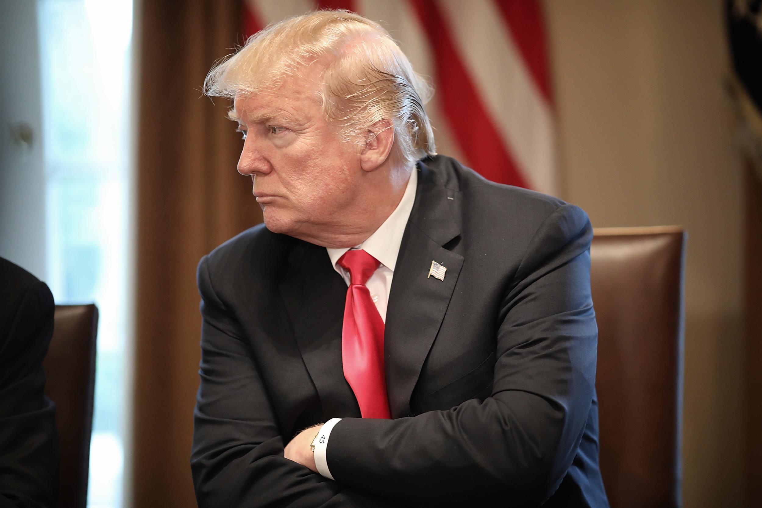 President Donald Trump participates in a meeting with leaders of the steel and aluminum industries at the White House