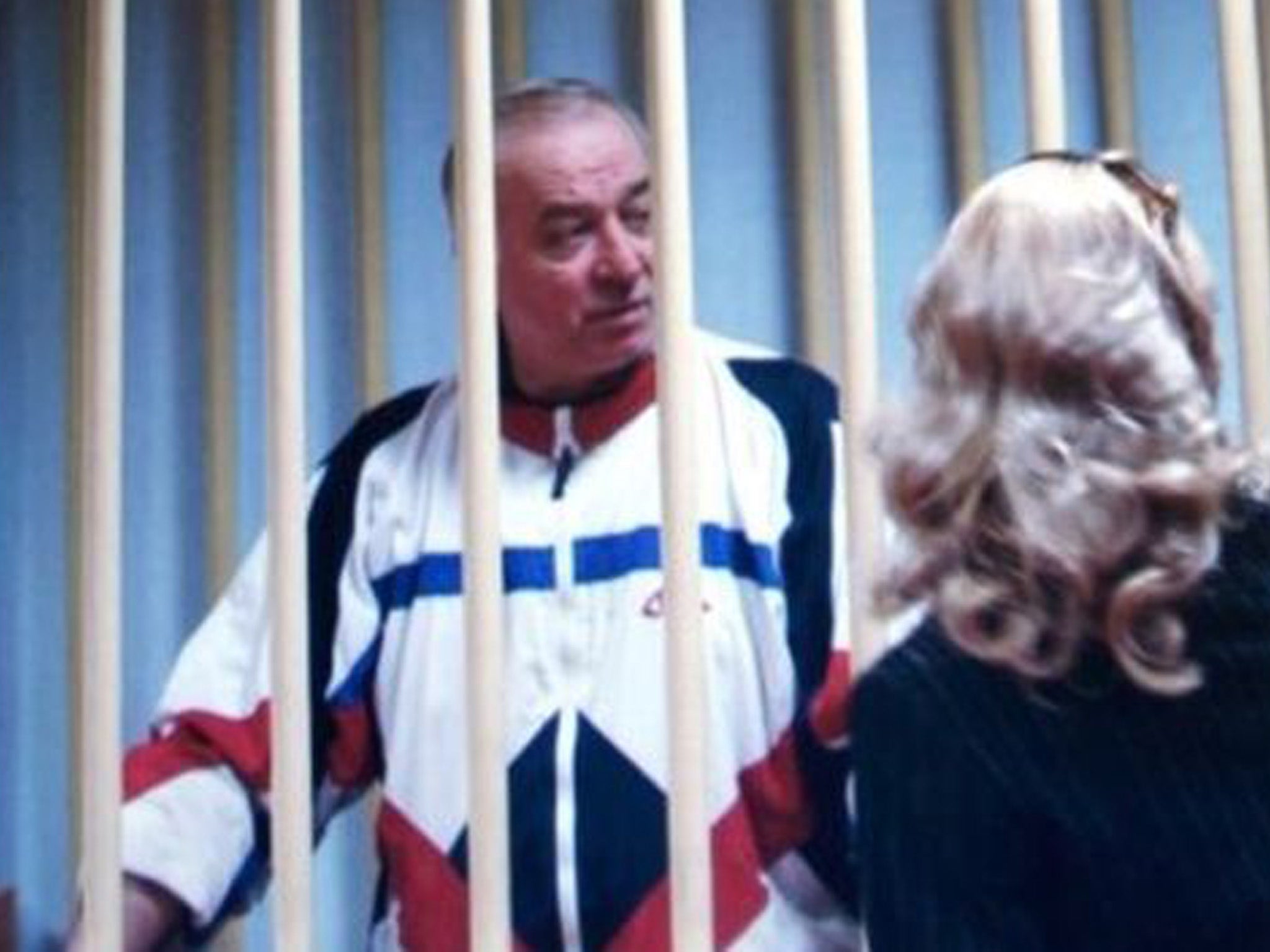 Former Russian spy Sergei Skripal, who was among those poisoned by Novichok, is captured talking to his lawyer from behind bars outside a courtroom in Moscow in 2006