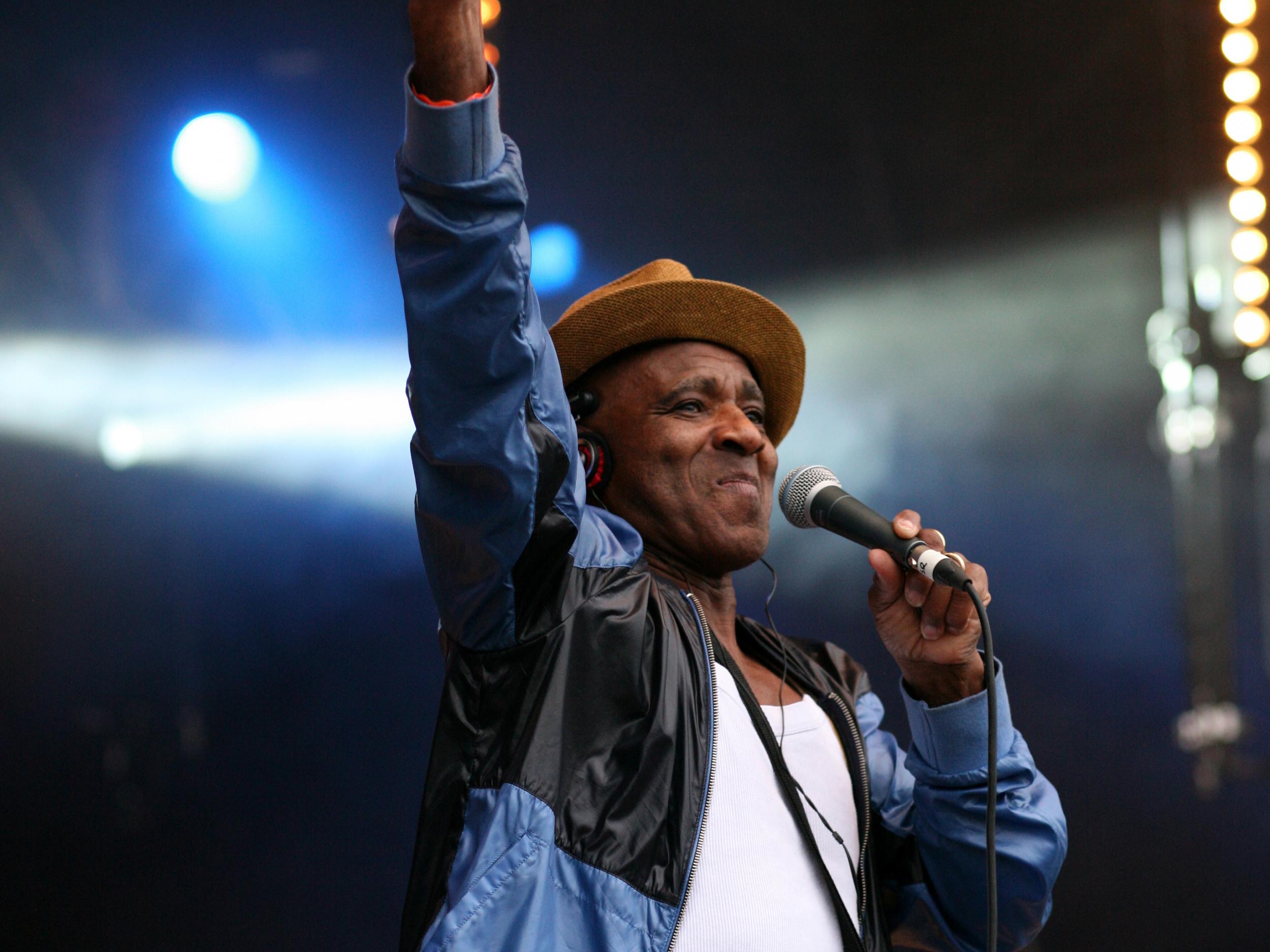 Amoo on stage at Wychwood Festival at Cheltenham Racecourse in 2014