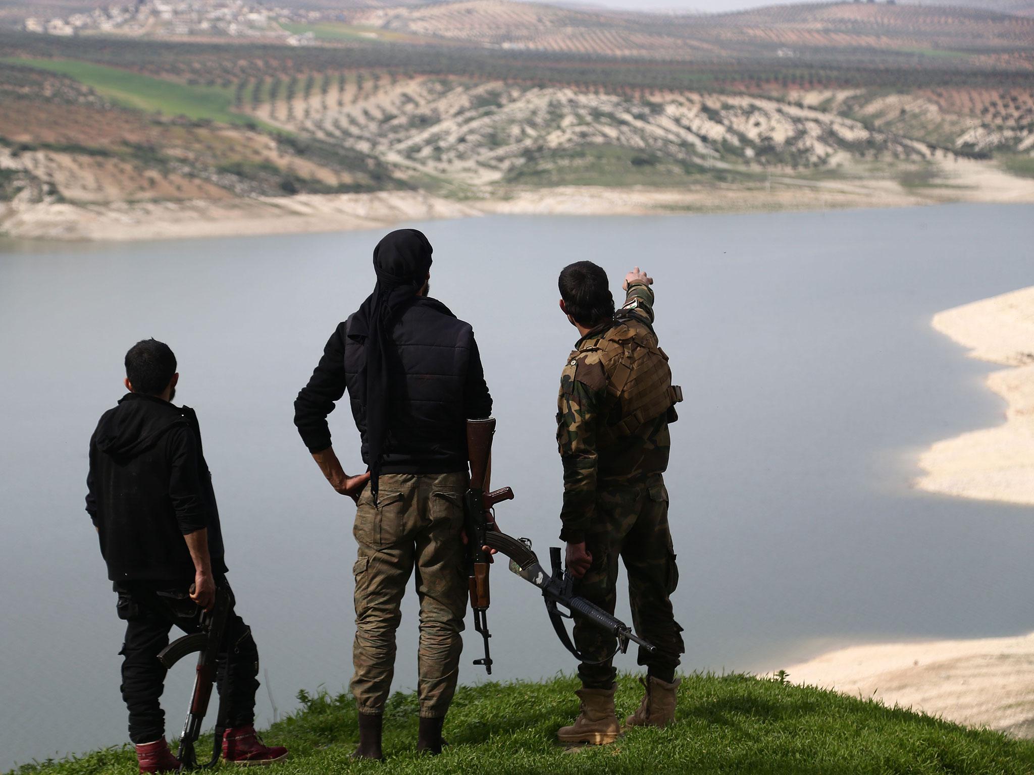 Turkish-backed Free Syrian Army fighters by Lake Maydanki, north of Afrin, after they took control of the nearby village of Ali Bazan on Sunday