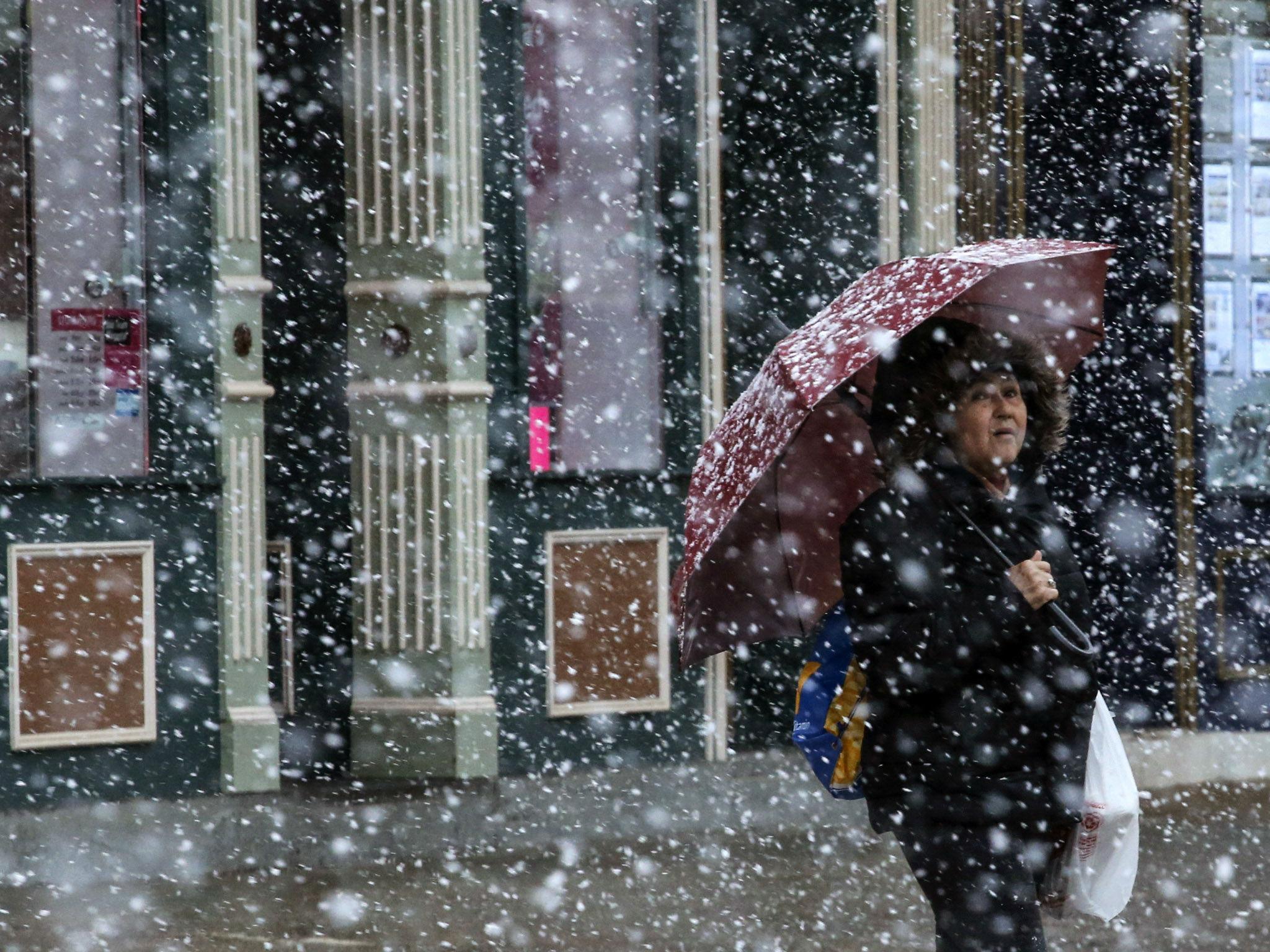 A woman waits to cross the street in New Jersey