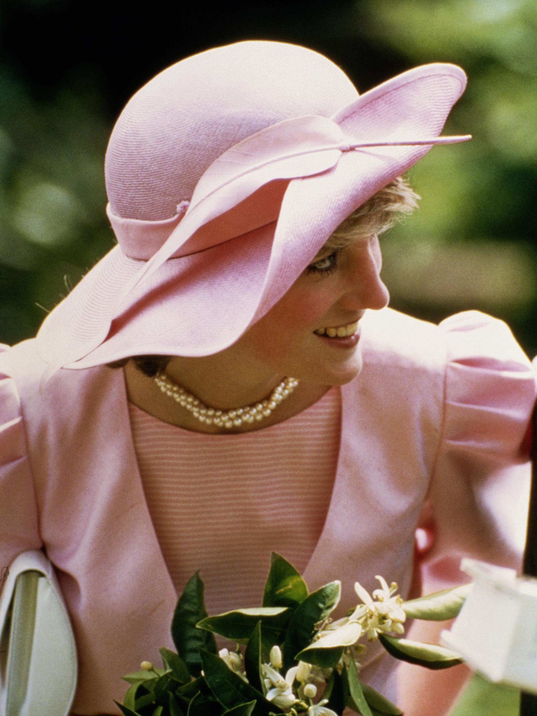 &#13;
Diana wearing a John Boyd hat during a visit to a fruit farm in Sicily &#13;