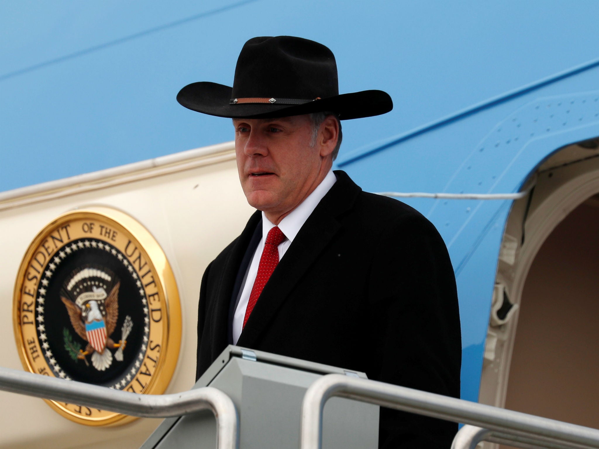 Interior Secretary Ryan Zinke steps from Air Force One