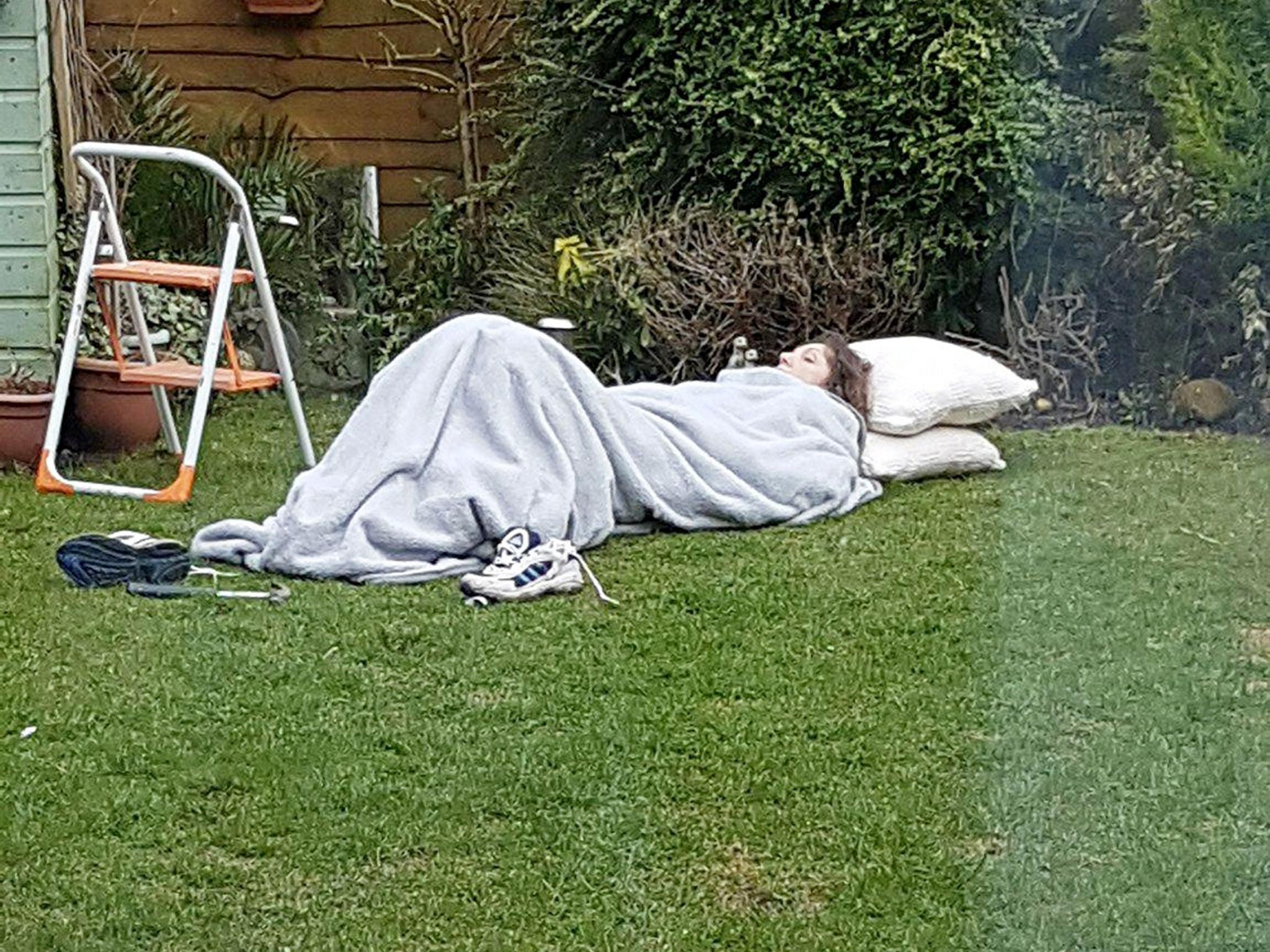 Her two daughters covered her in blankets as she shook because of the freezing temperatures