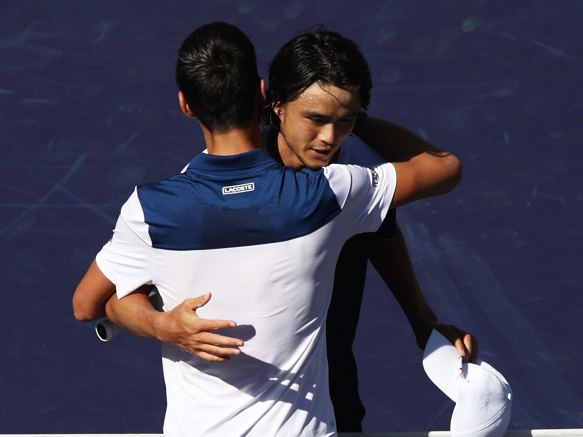 Daniel is congratulated by Djokovic after his victory