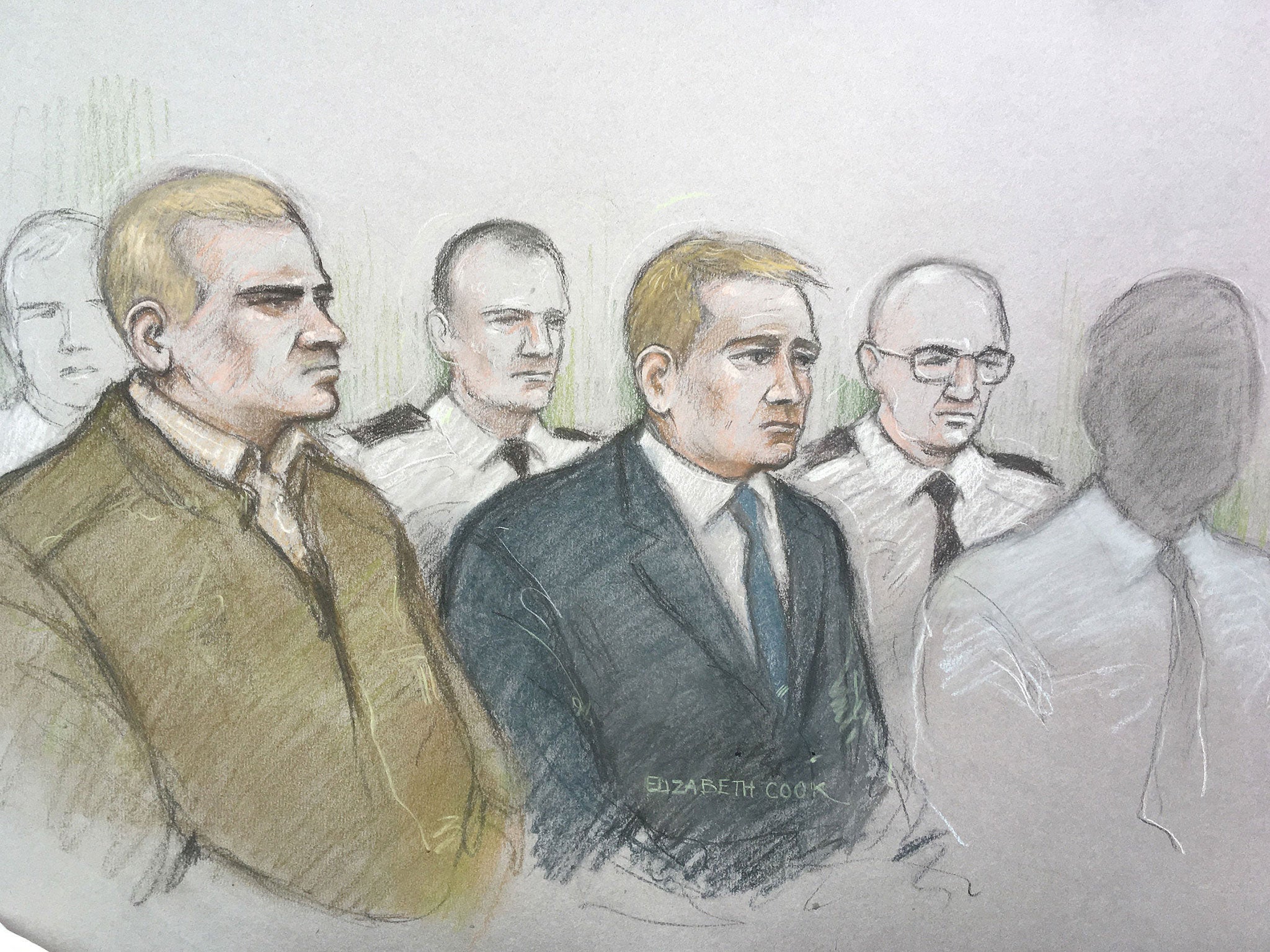 Mikko Vehvilainen and Mark Barrett (centre) on trial at Birmingham Crown Court where they are accused of being part of the proscribed organisation National Action.