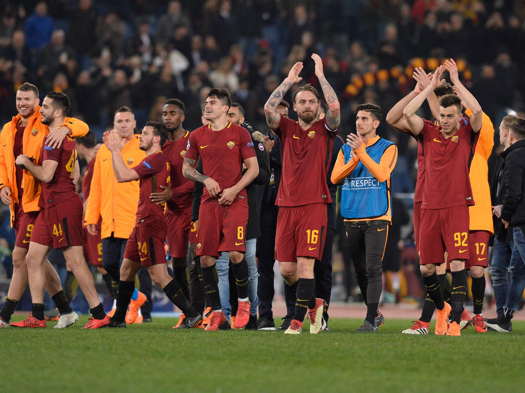 Roma's players celebrate their victory after the final whistle