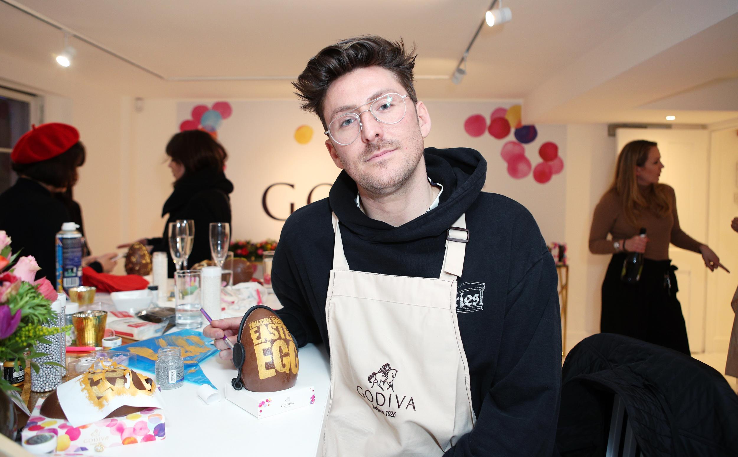 &#13;
Designer Henry Holland with his Easter egg entitled "Egg Head" &#13;