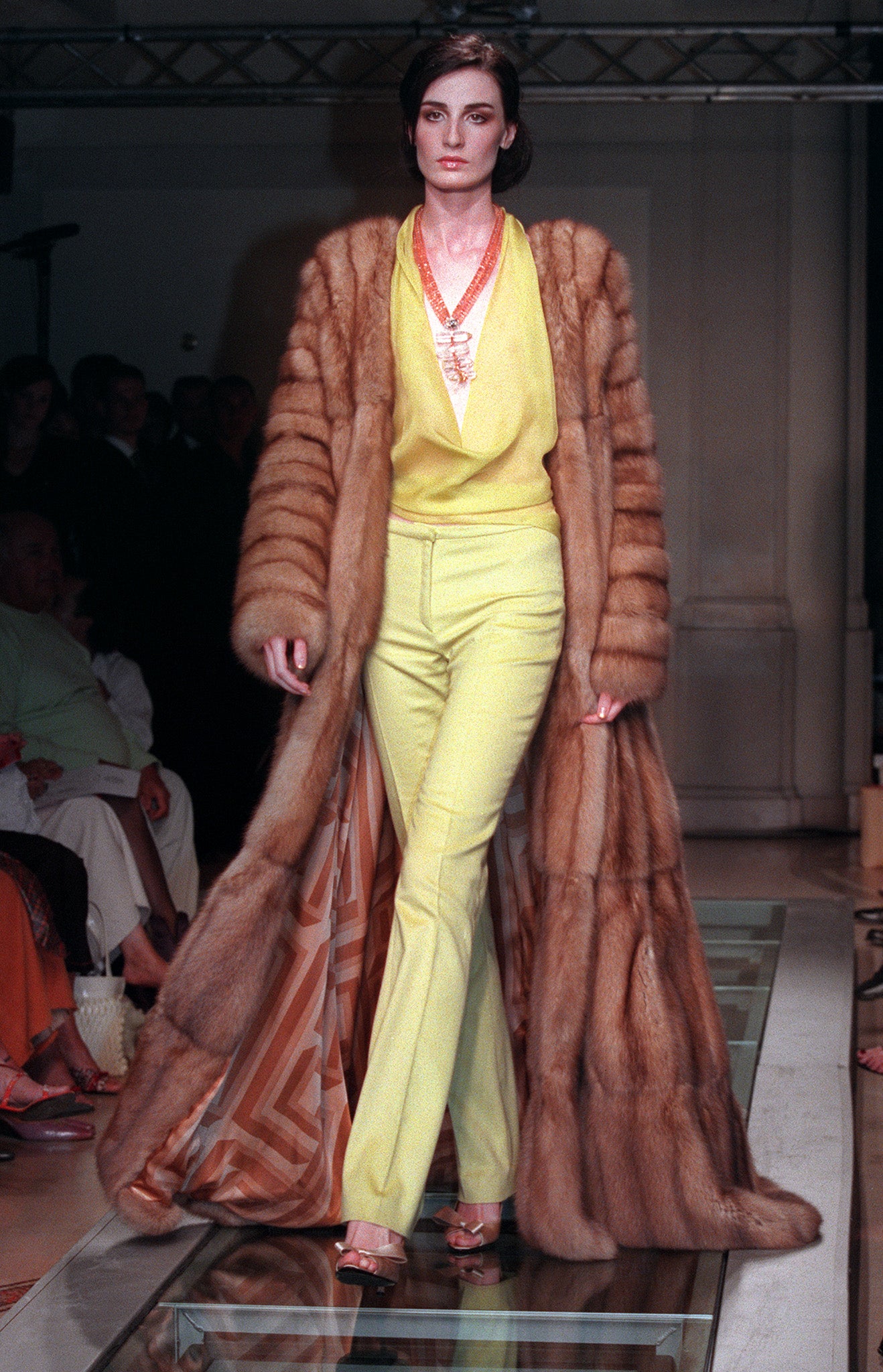 British model Erin O'Connor dons a floor-length fur coat on the Versace Haute Couture autumn/winter 2001 runway in Paris.