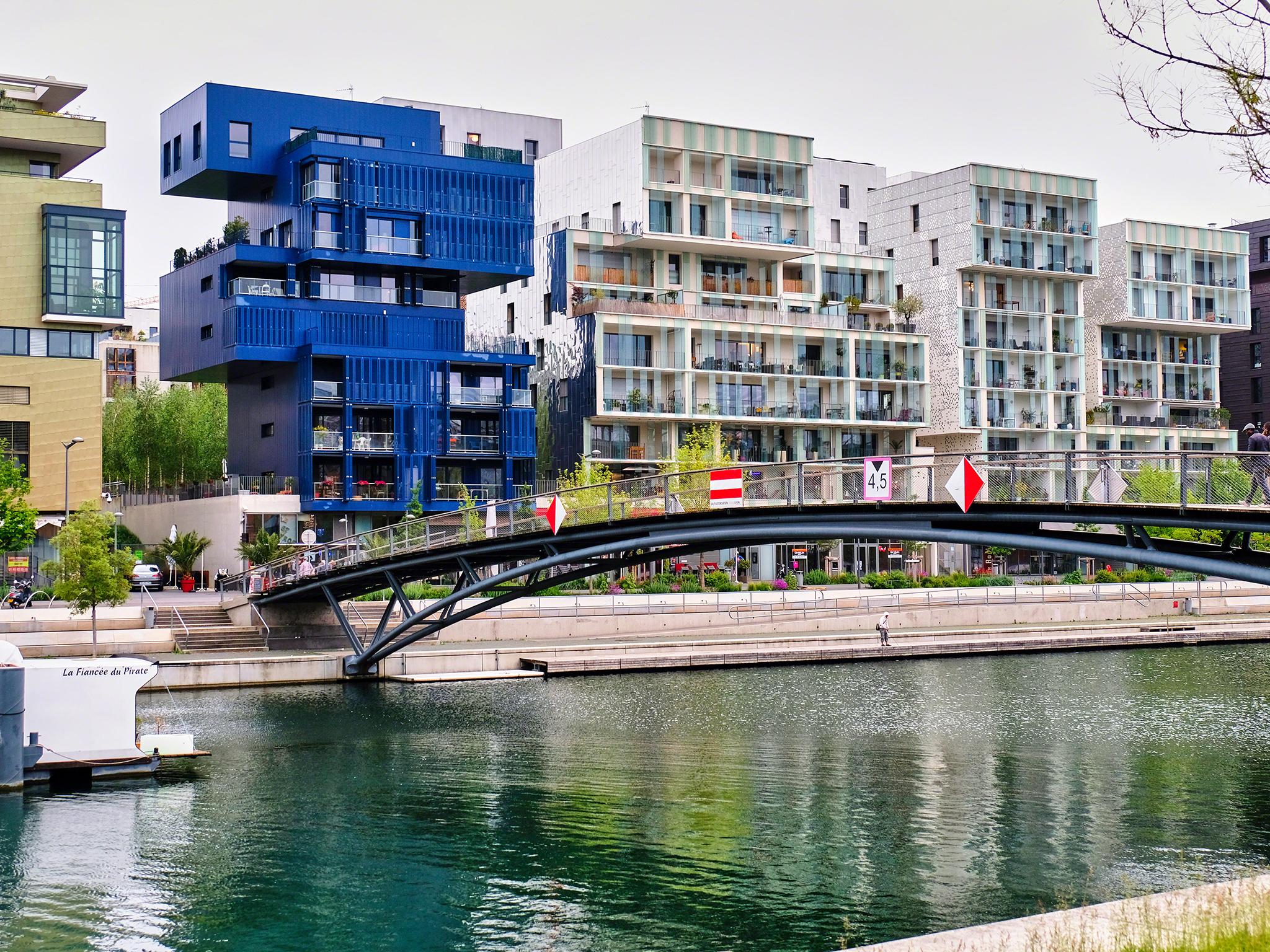 Modern apartment buildings along the Saone canal in Lyon’s Confluence district