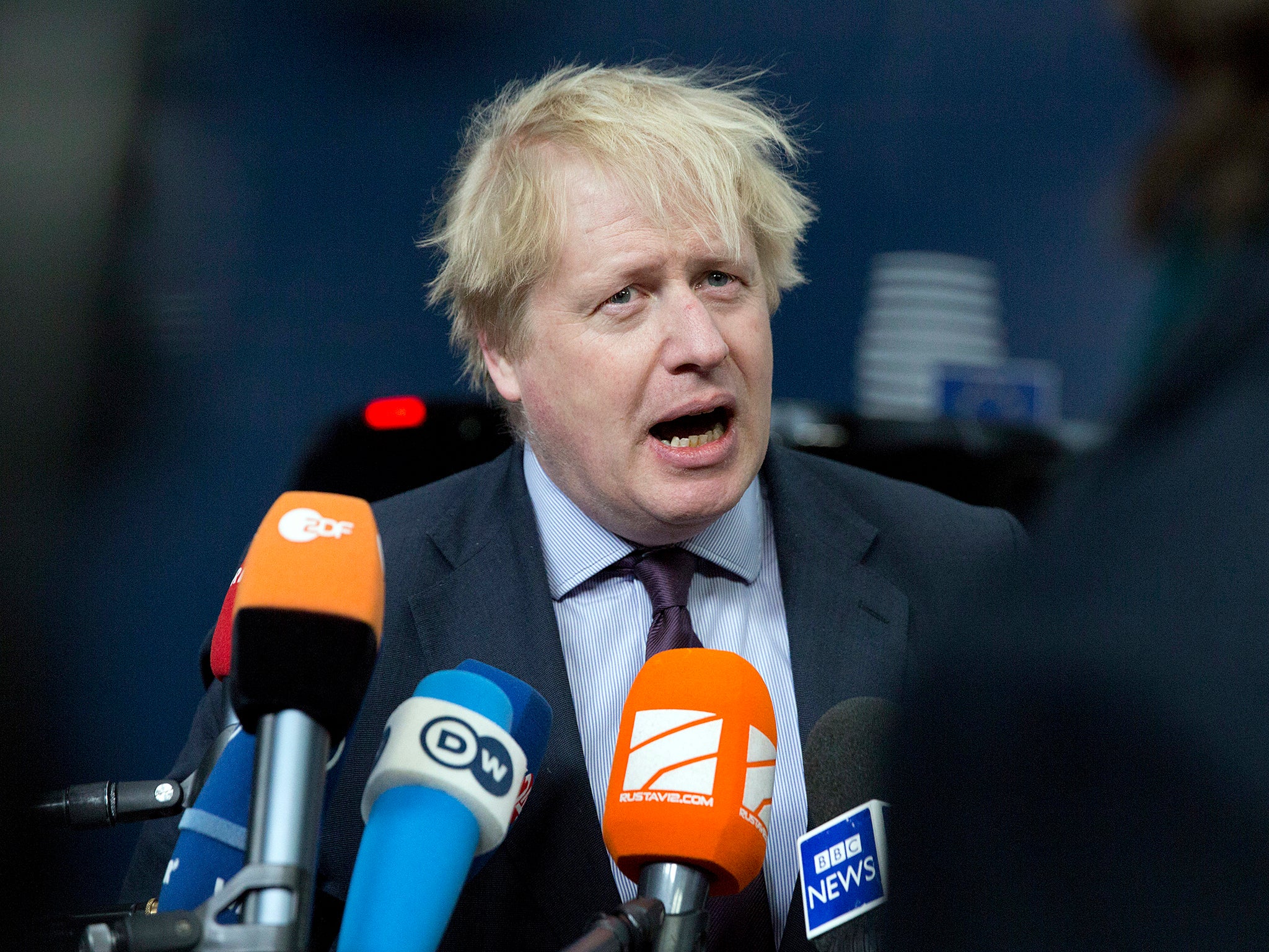 Boris Johnson addresses reporters in Brussels