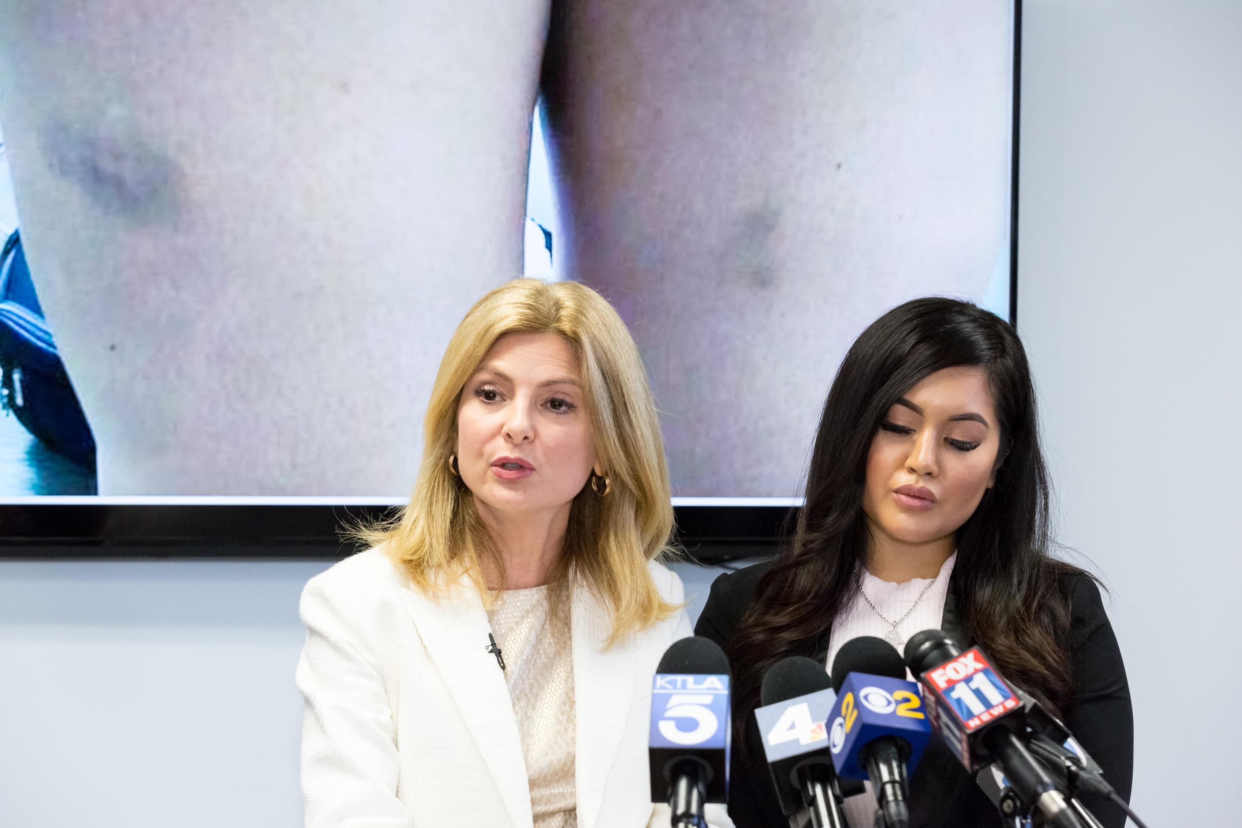 &#13;
Andrea Buera (R), who is accusing singer Trey Songz of assaulting her, speaks during a press conference with her attorney Lisa Bloom (L) at The Bloom Firm on March 13, 2018 in Woodland Hills, California. Buera has already obtained a restraining order based on the alleged assault that took place February 18 in Hollywood &#13;