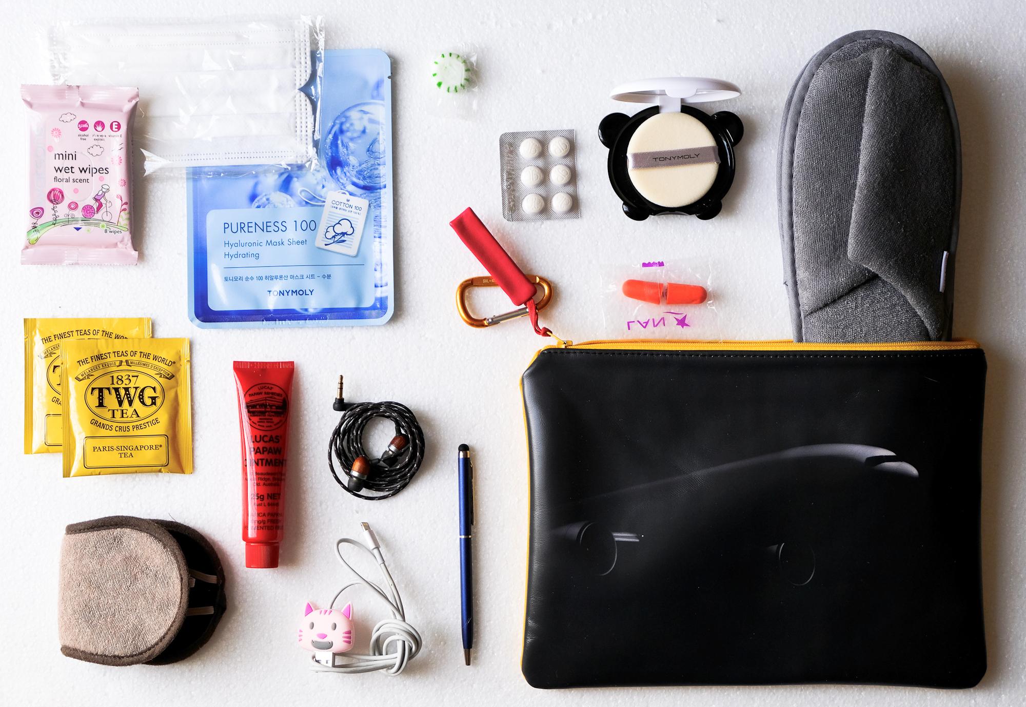 Cynthia packs her inflight essentials in a pouch to keep legroom clear