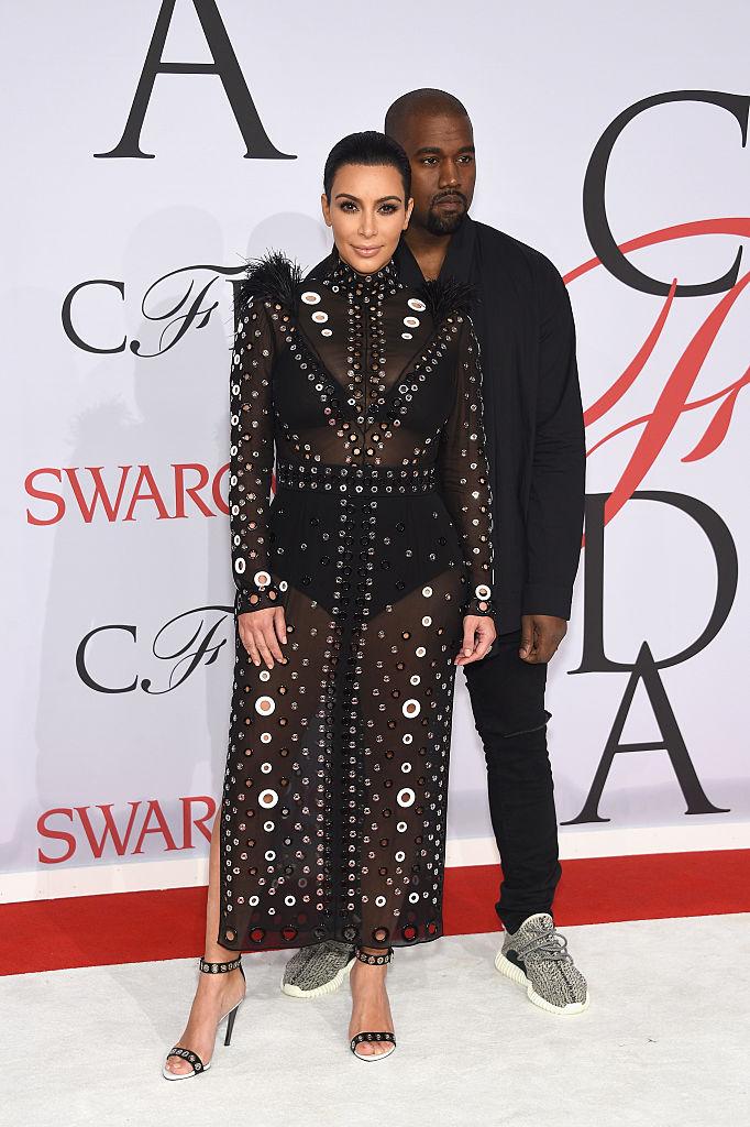 Kim Kardashian and Kanye West attend the 2015 CFDA Fashion Awards