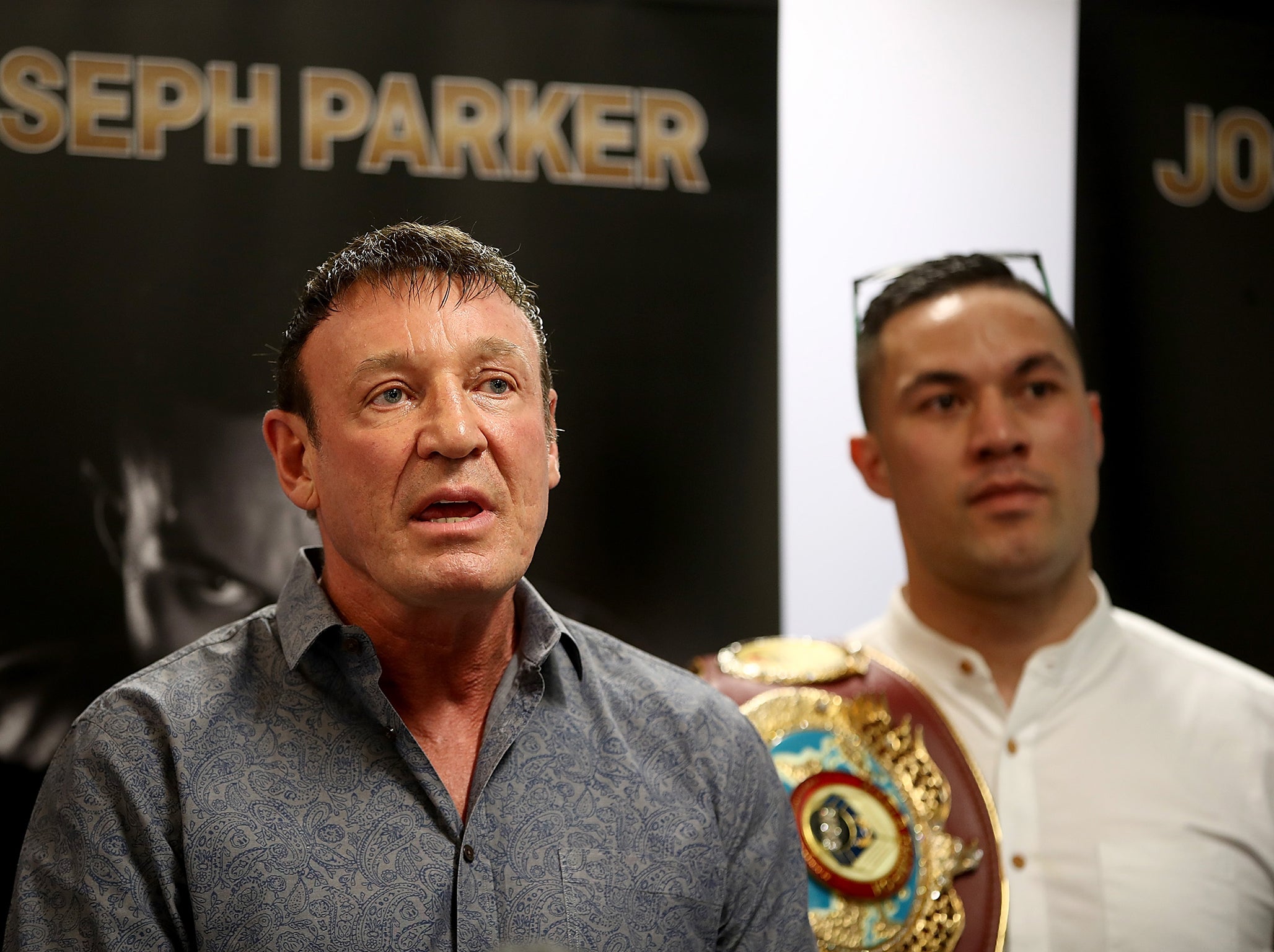 Barry speaking alongside Parker