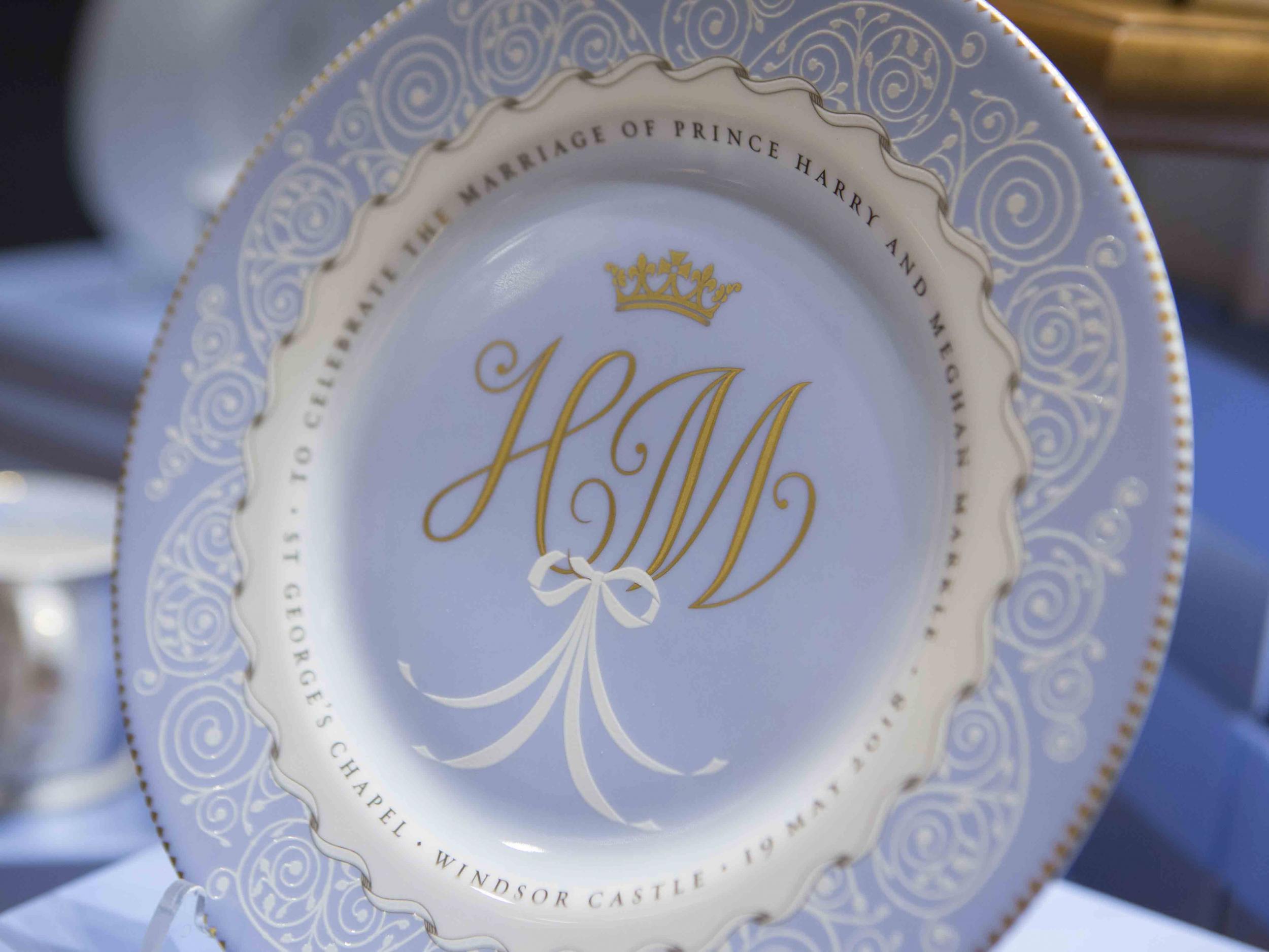 The cornflower blue plate finished in 22 carat gold costs £49 (The Royal Collection Trust)