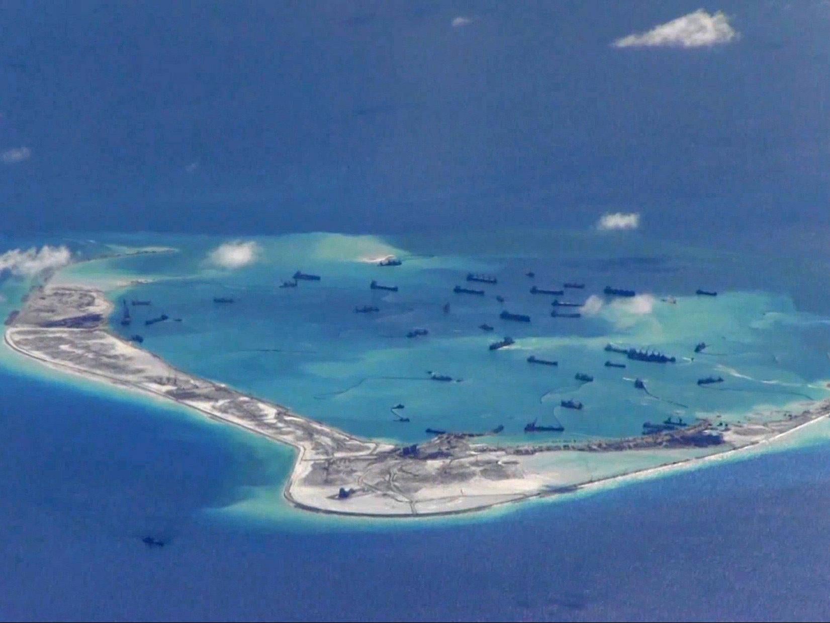 Chinese dredging vessels are purportedly seen in the waters around Mischief Reef, in an image taken by an American P-8A Poseidon surveillance aircraft