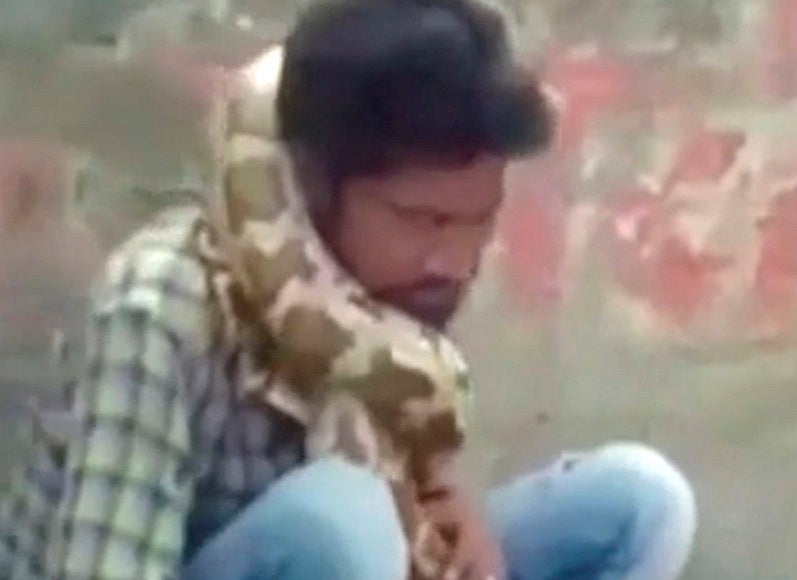 The man passed out in front of his audience after the snake wrapped itself around his neck