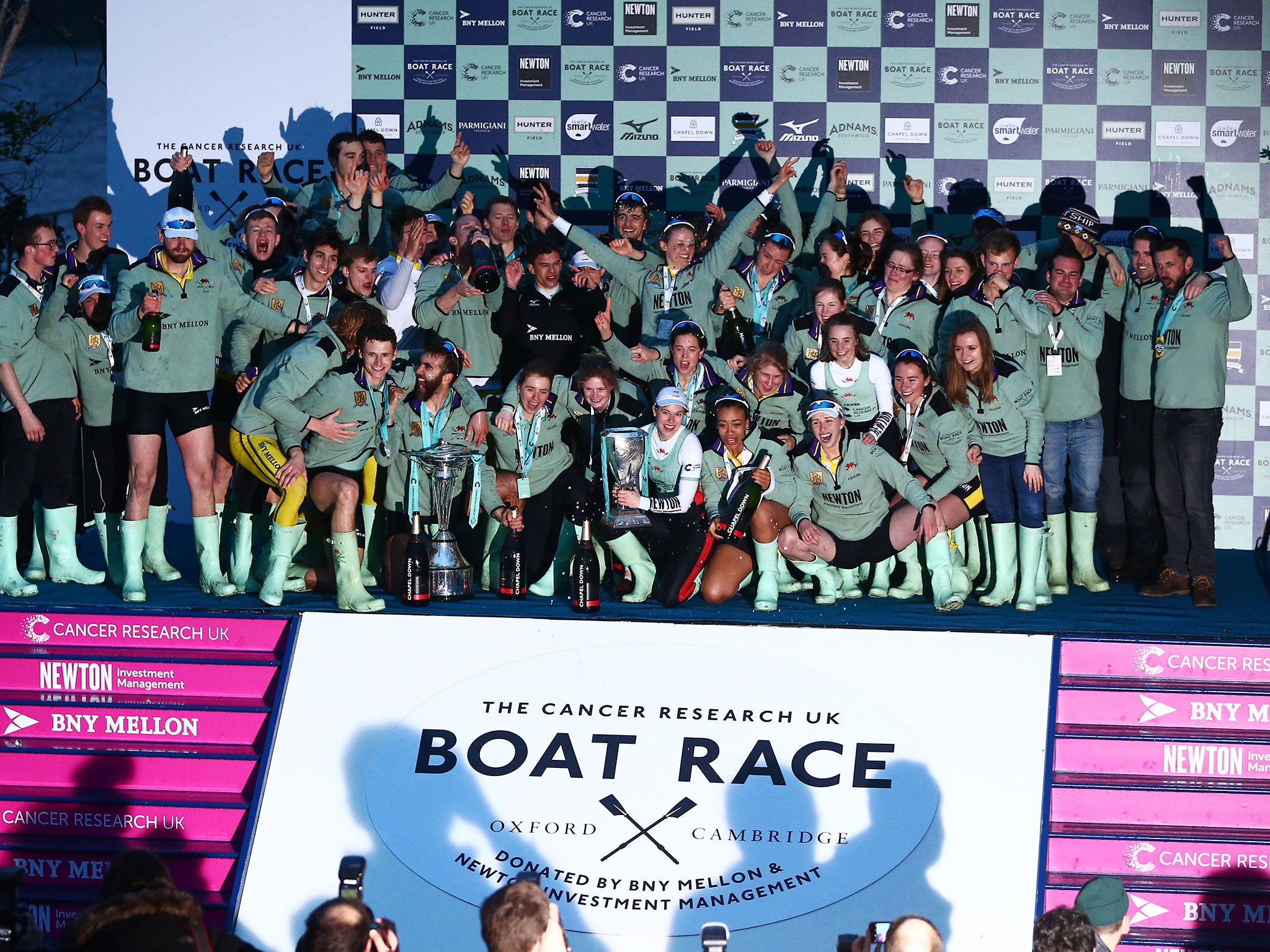 Cambridge men and women celebrate together after their double victory on Saturday