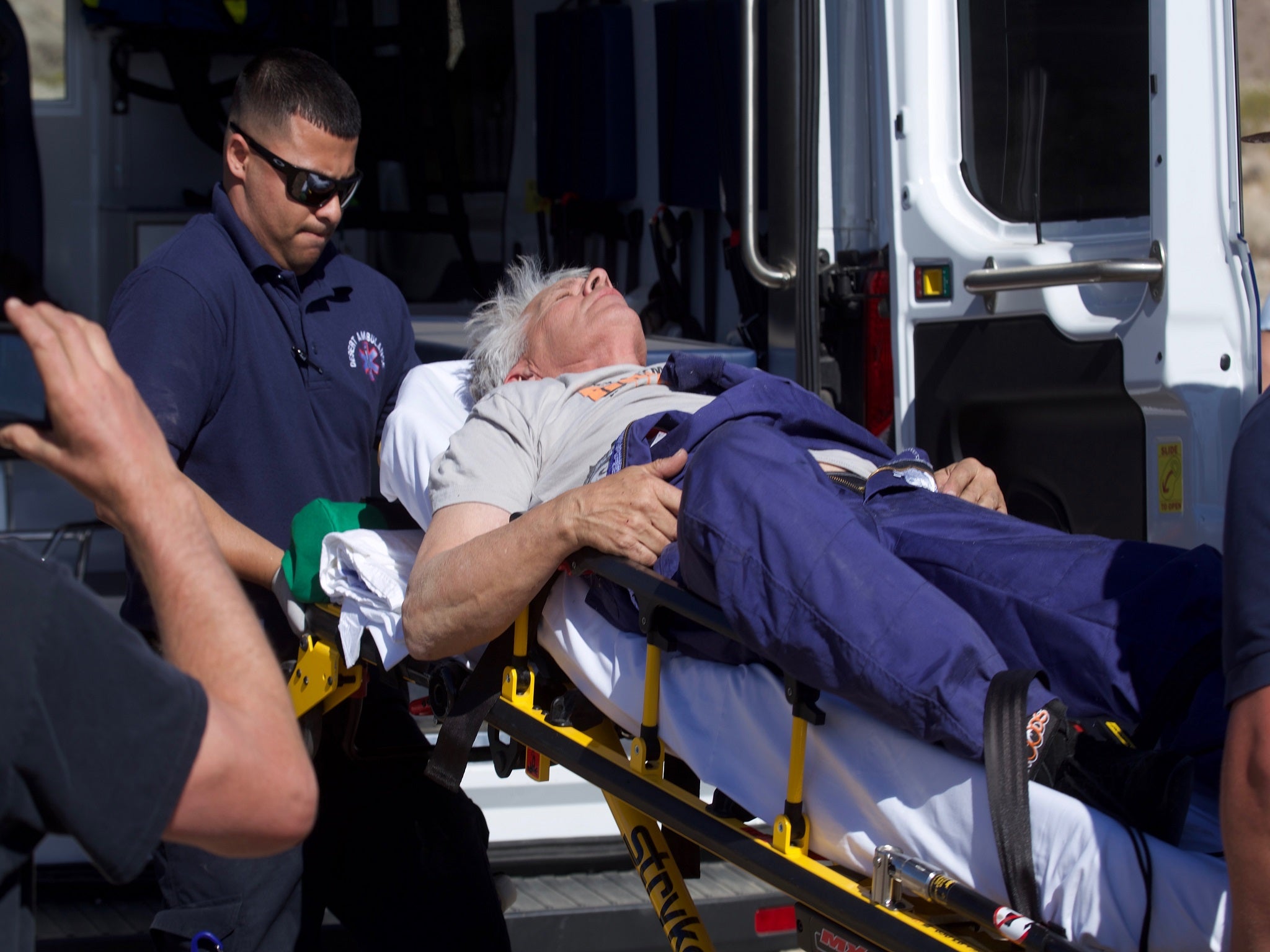 ‘Mad’ Mike Hughes is checked by paramedics after his homemade rocket trip